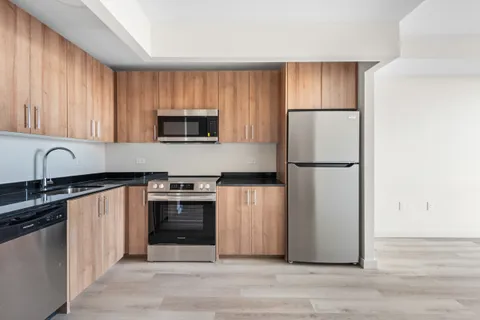 a kitchen with a refrigerator sink and microwave