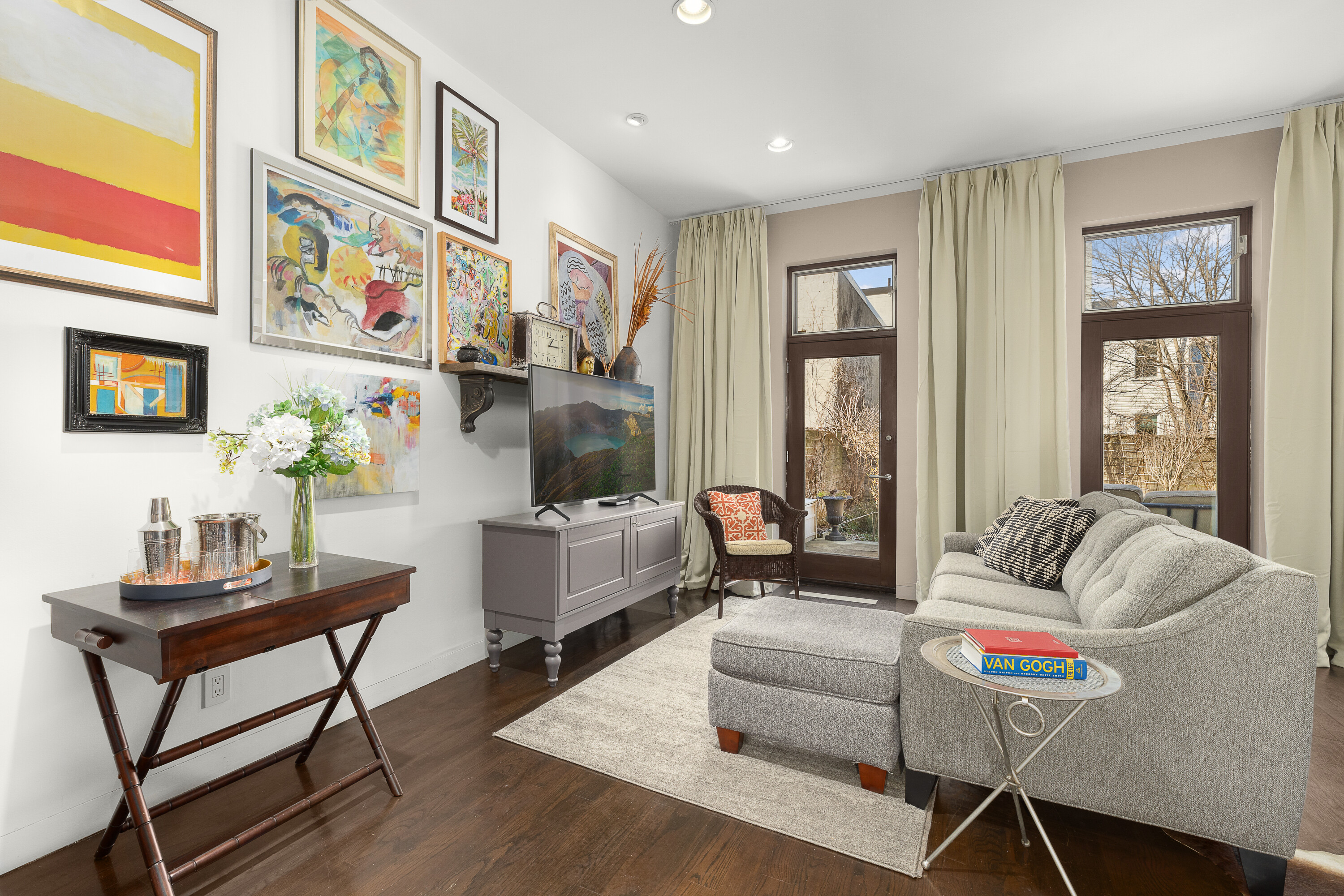 38-06 28th Street, Unit 1 Queens, NY 11101 - Photo 2 of 8 a living room with furniture and a potted plant