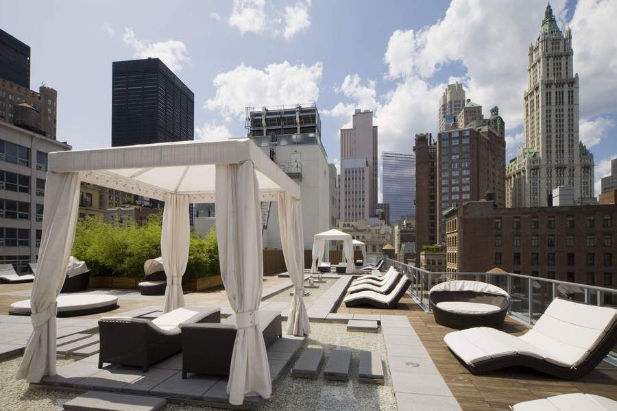 111 Fulton Street, Unit 309 Manhattan, NY 10038 - Photo 6 of 12 a view of a patio with couches chairs and a potted plant