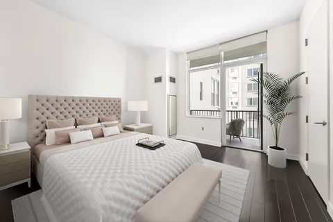 a bedroom with double bed and a window