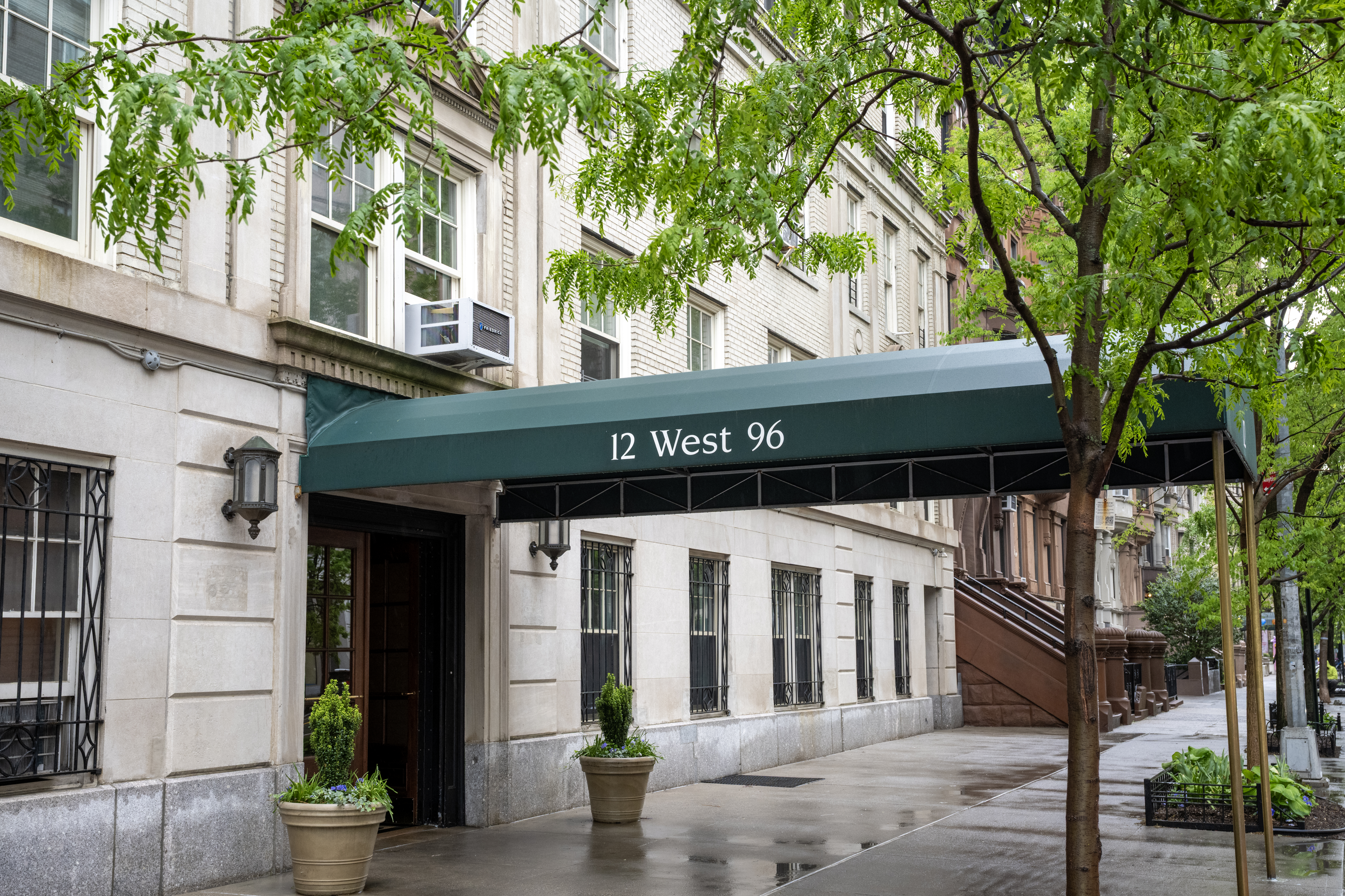 12 West 96th Street, Unit 16A Manhattan, NY 10025 - Photo 12 of 13 a front view of a house with a tree