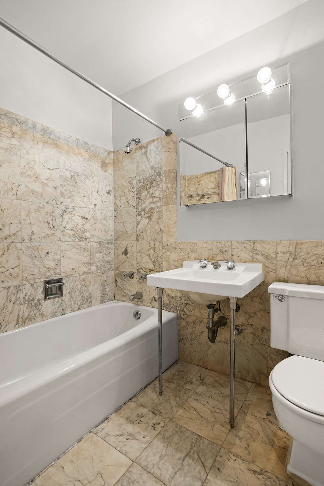 420 East 51st Street, Unit 10H Manhattan, NY 10022 - Photo 6 of 14 a bathroom with a sink toilet and shower