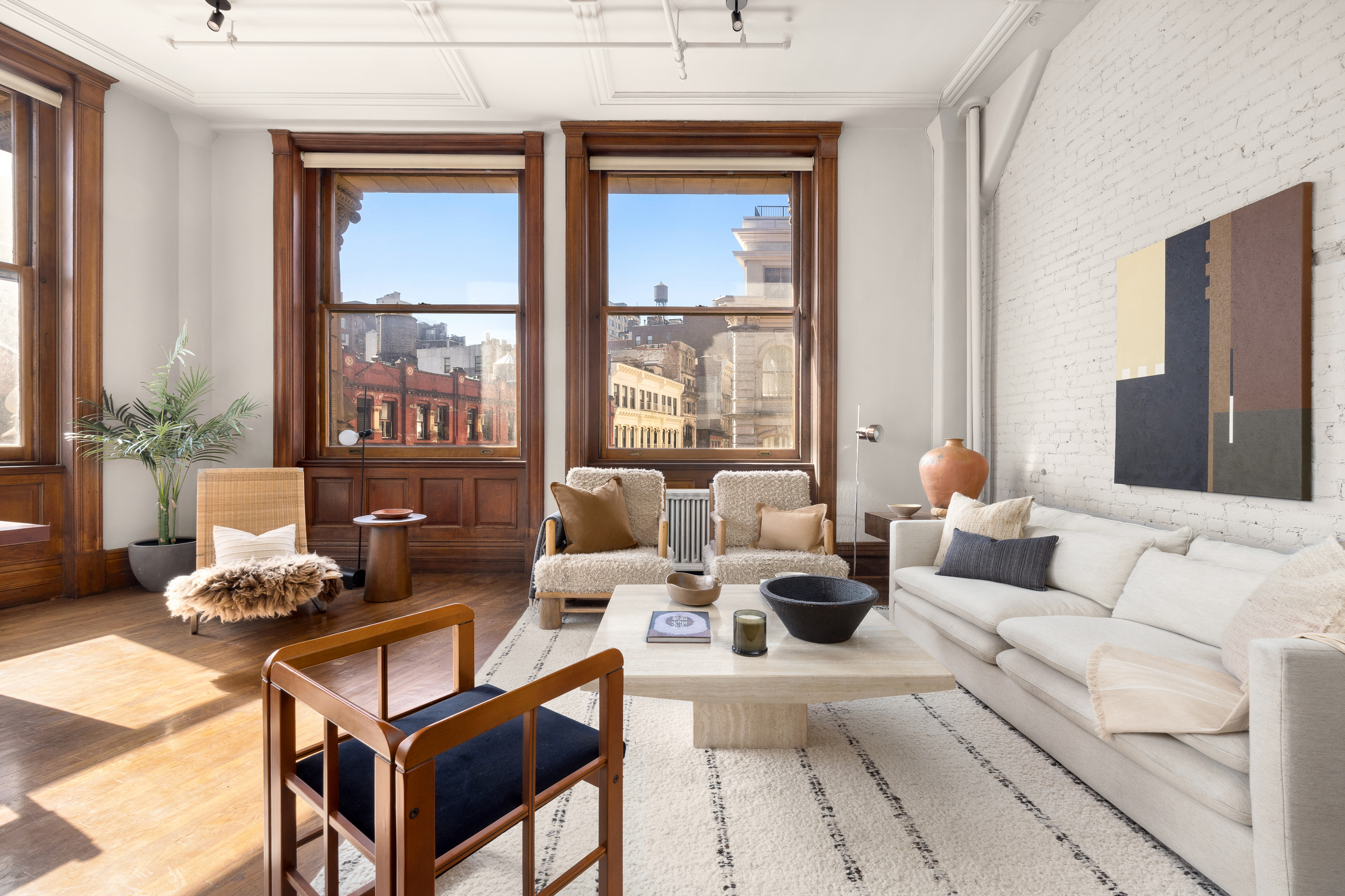 874 Broadway, Unit 501 Manhattan, NY 10003 - Photo 3 of 17 a living room with furniture and a large window