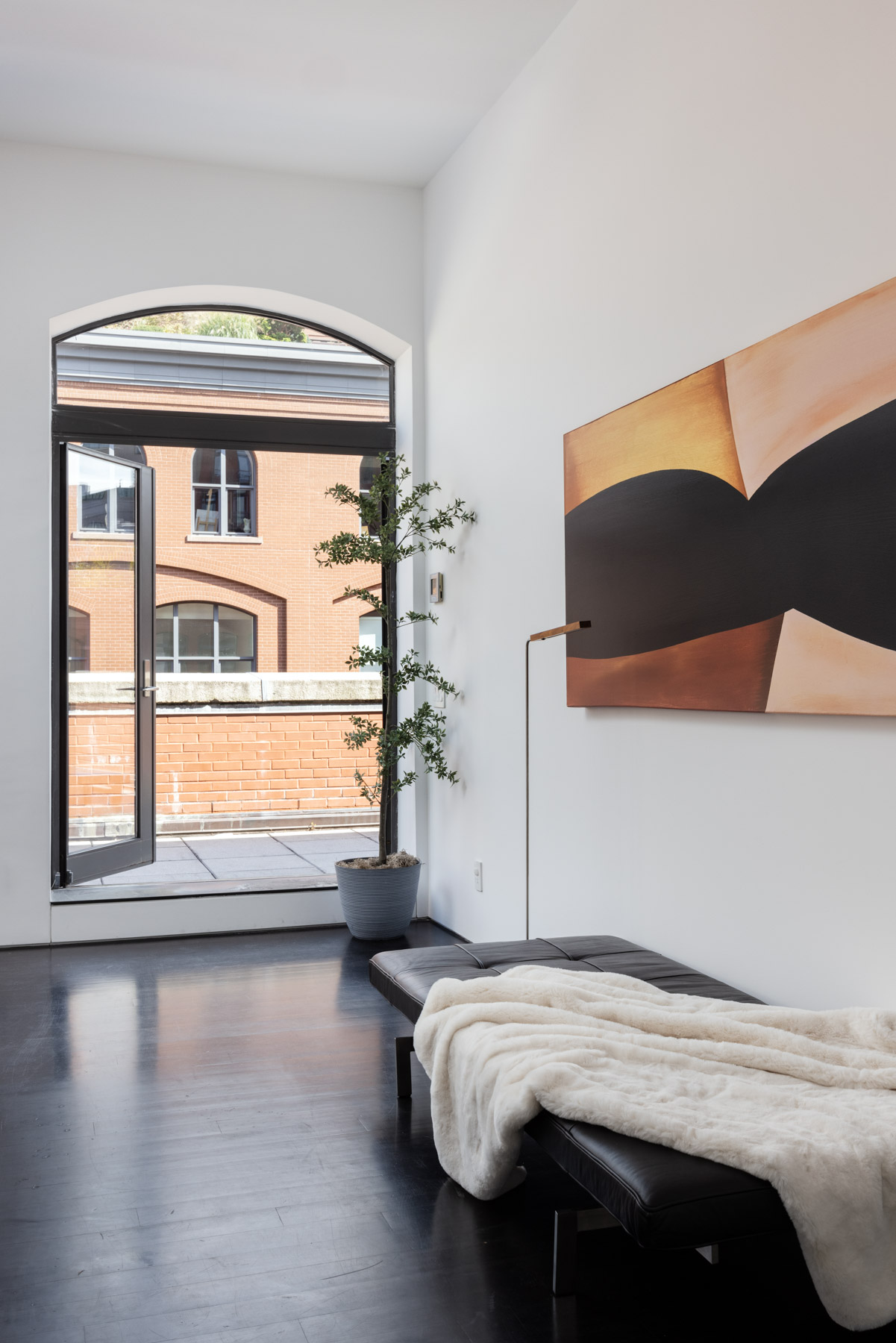 92 Laight Street, Unit PHC Manhattan, NY 10013 - Photo 4 of 16 a bedroom with a bed and a large window