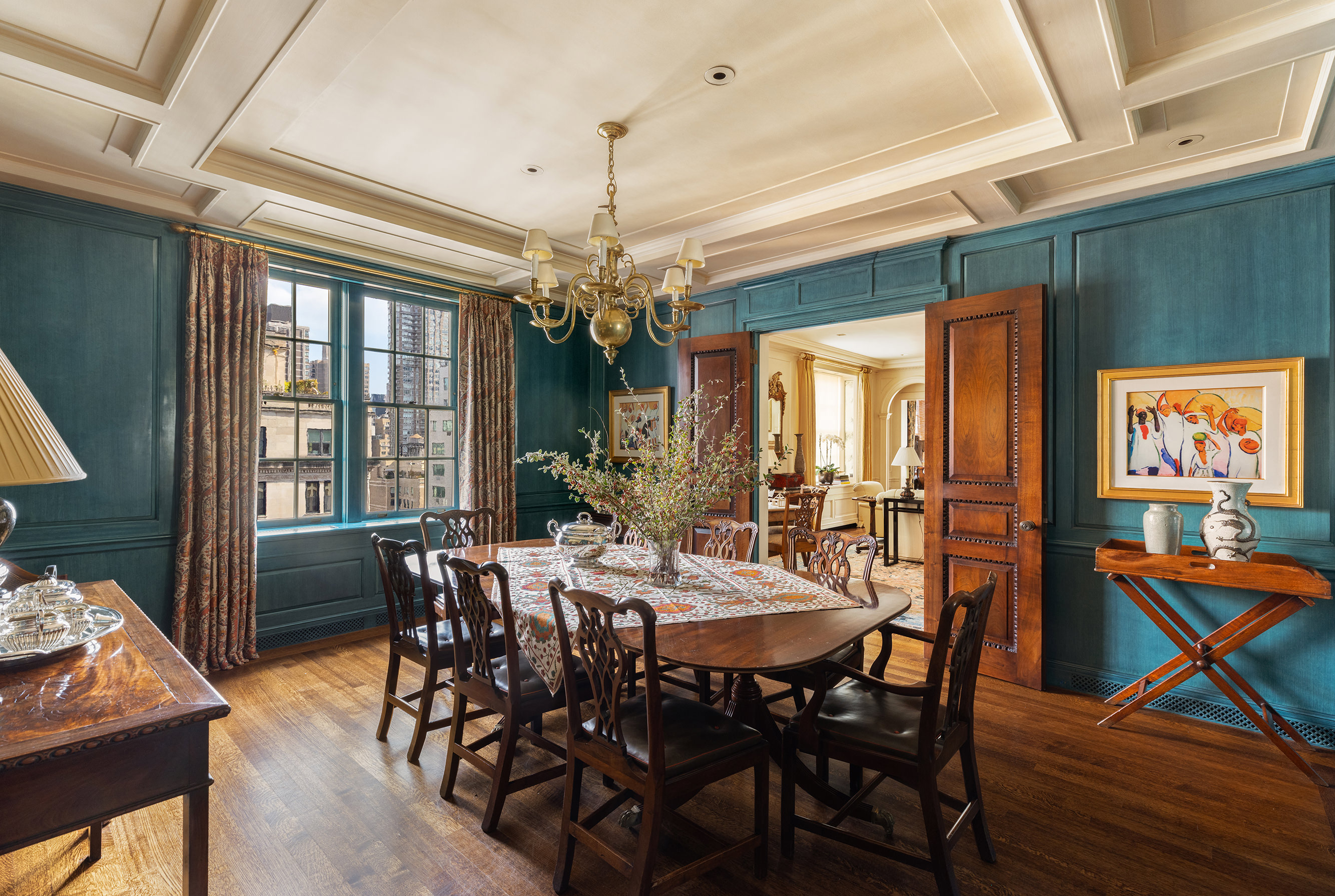 620 Park Avenue, Unit 14 Manhattan, NY 10065 - Photo 15 of 32 a view of a dining room with furniture wooden floor and chandelier