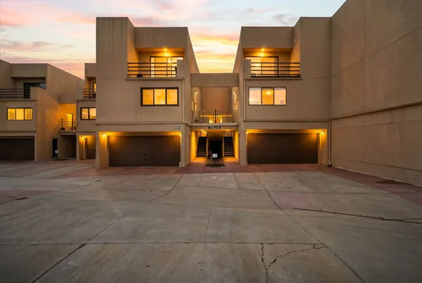 a view of an empty room with window and fireplace