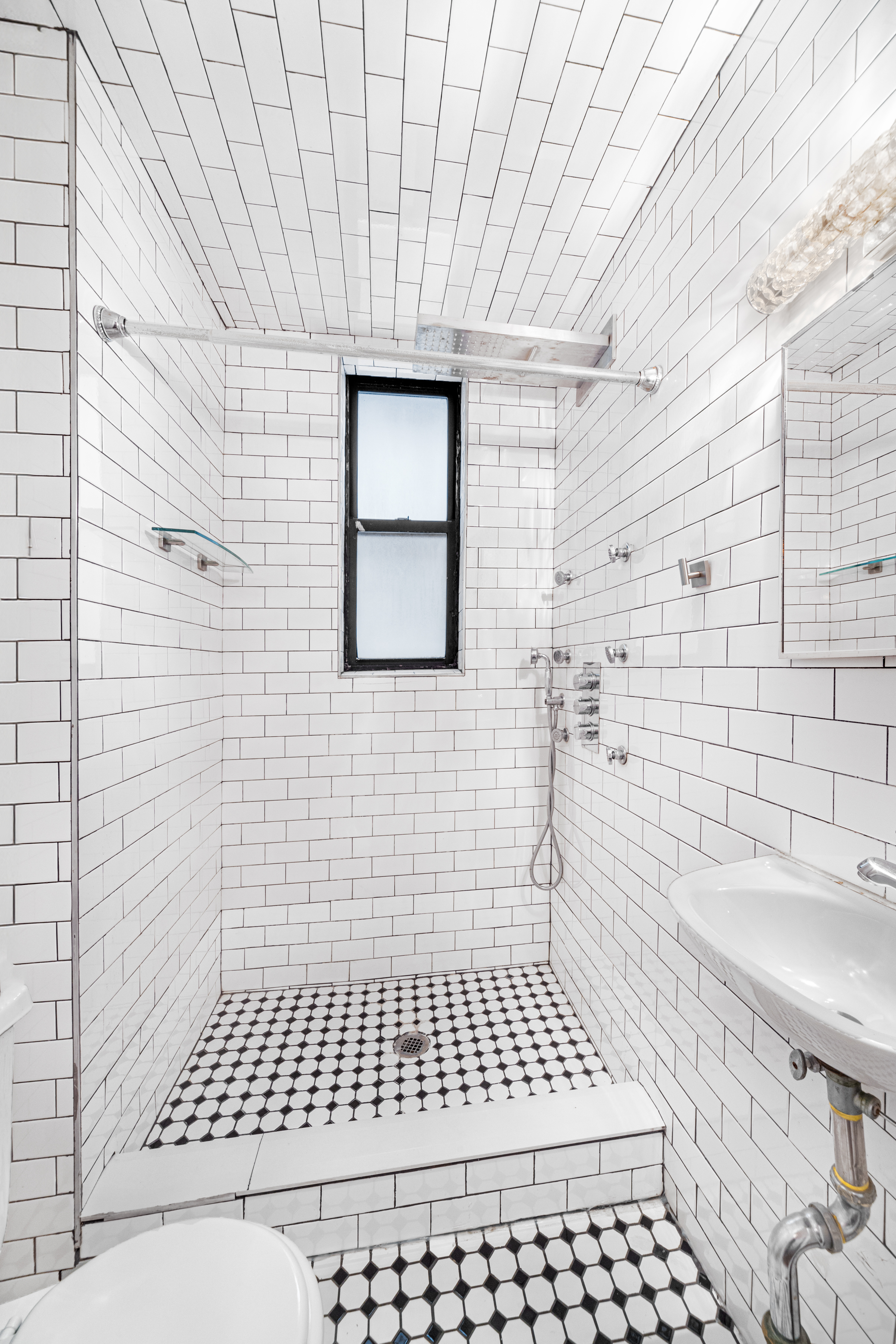 65 West 107th Street, Unit 2D Manhattan, NY 10025 - Photo 5 of 7 a bathroom with a sink a toilet and a shower