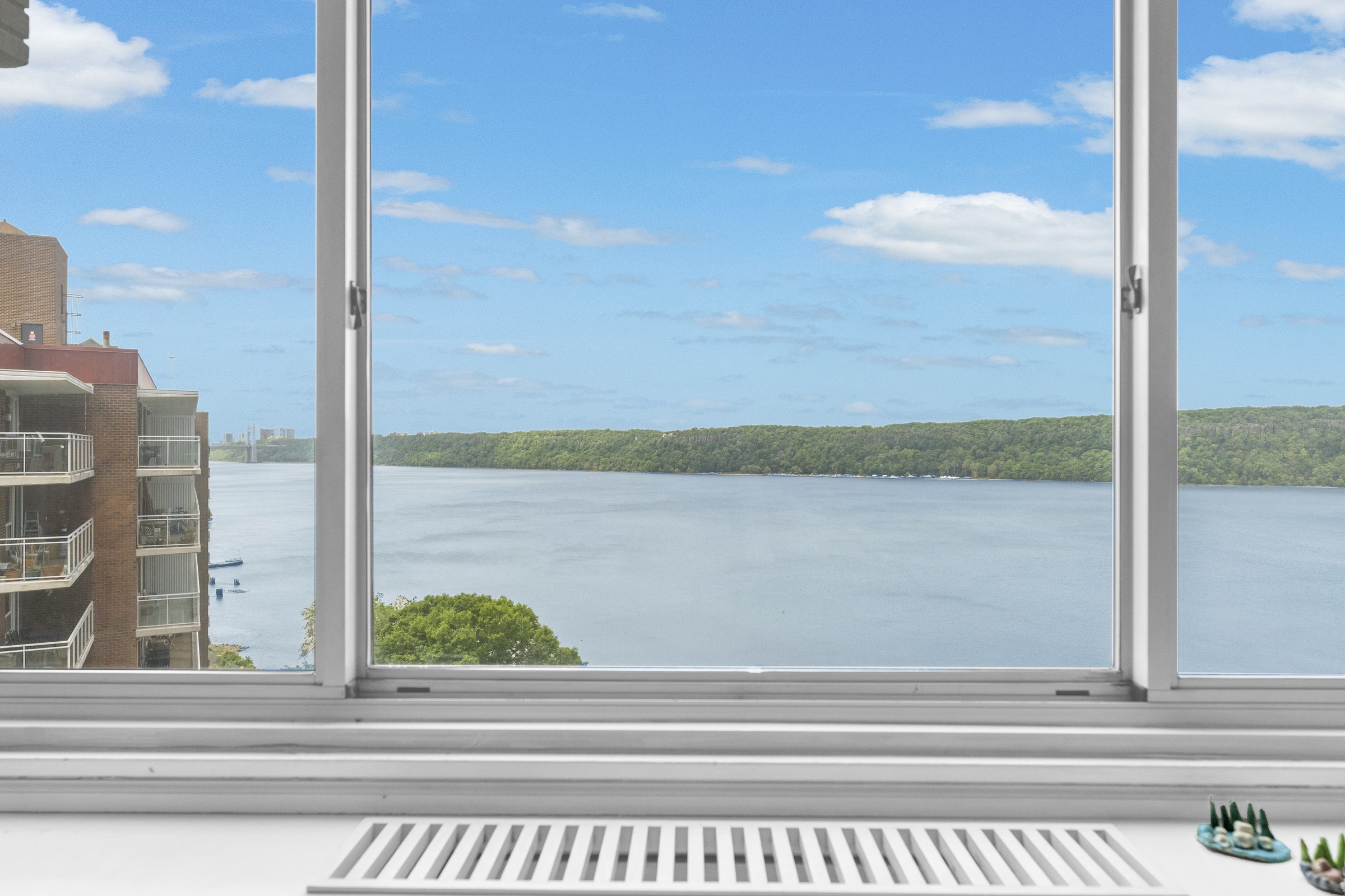 2621 Palisade Avenue, Unit 11J Bronx, NY 10463 - Photo 3 of 19 a view of a glass door