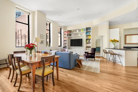 a living room with fireplace furniture and a flat screen tv