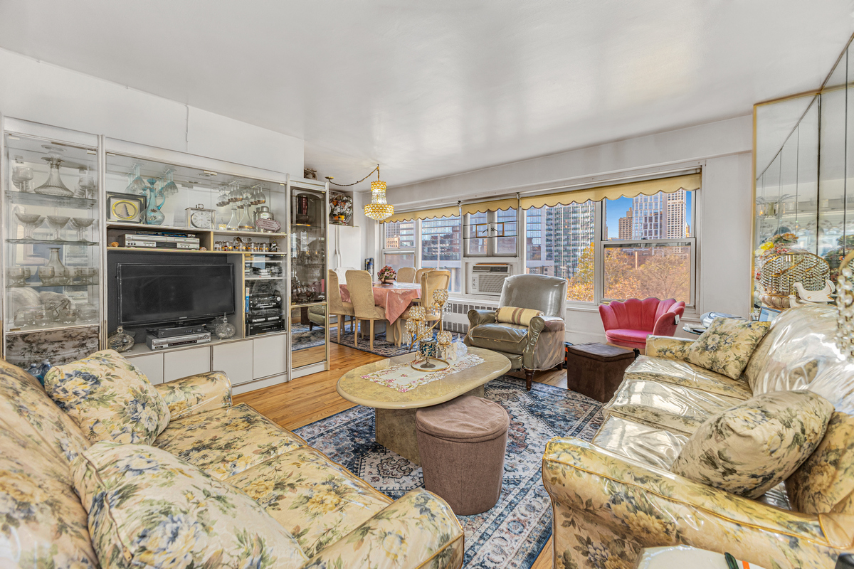 135 Ashland Place, Unit 8B Brooklyn, NY 11201 - Photo 2 of 11 a living room with furniture and a flat screen tv