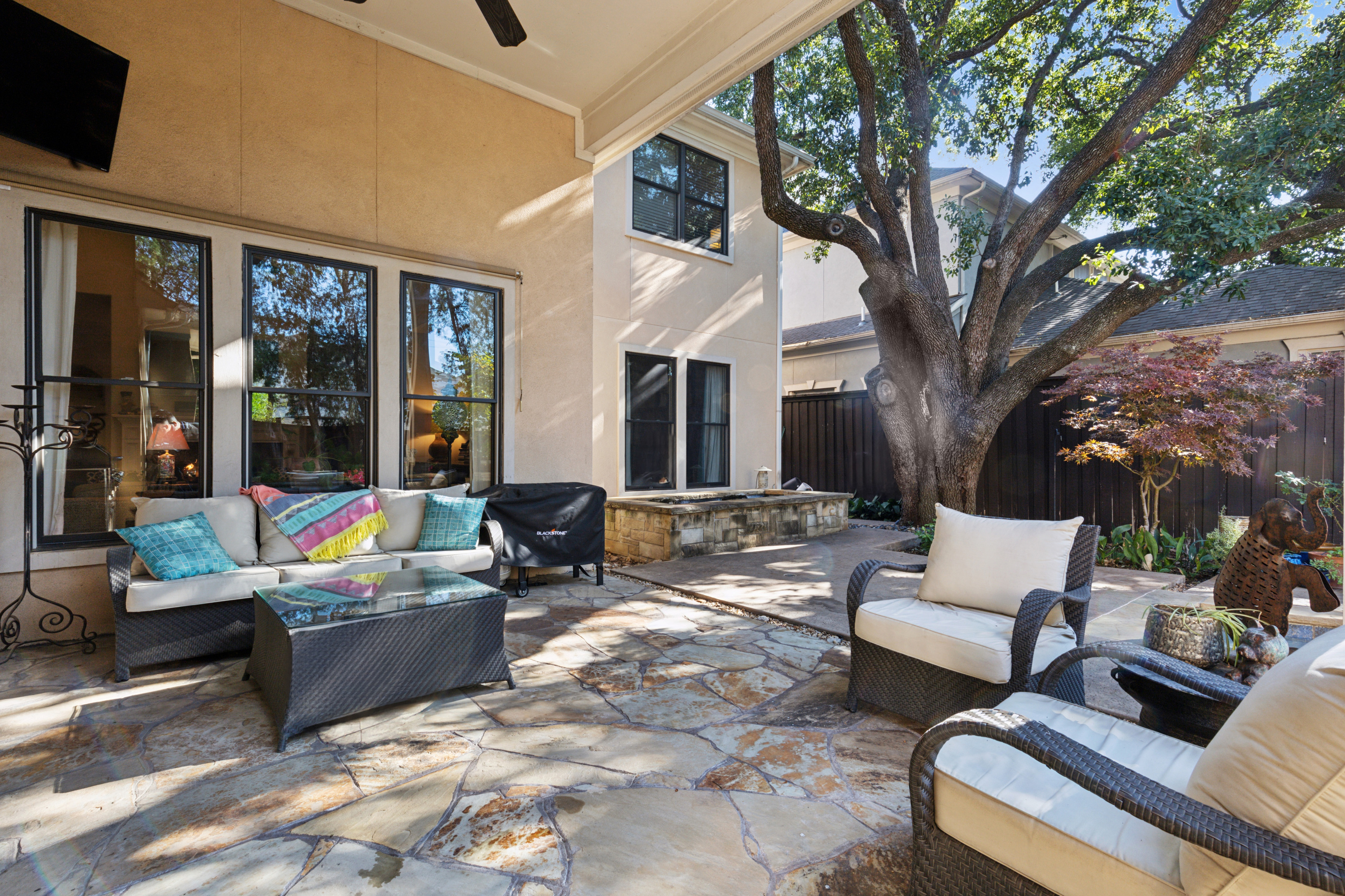 8411 Midway Road Dallas, TX 75209 - Photo 27 of 29 a outdoor living space with patio furniture and a fireplace