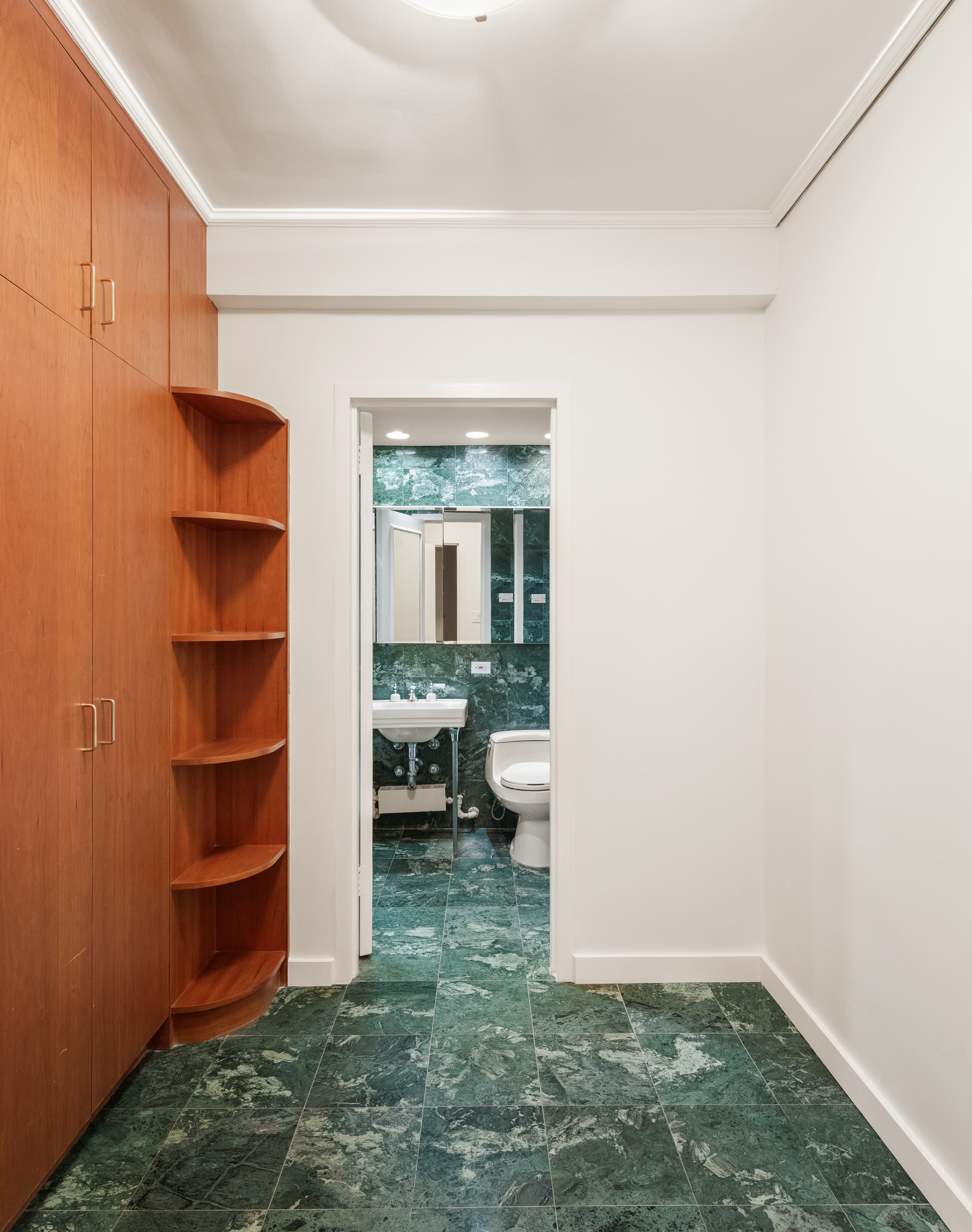 11 5th Avenue, Unit 5LW Manhattan, NY 10003 - Photo 12 of 19 a view of walk in closet with clothes and shoes