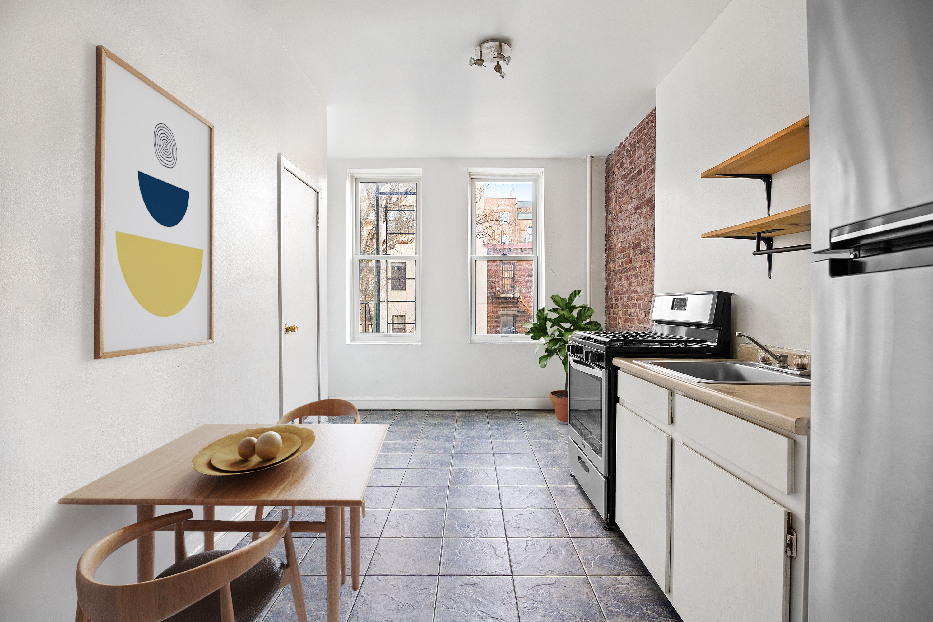 418 South 4th Street, Unit 2R Brooklyn, NY 11211 - Photo 3 of 6 a view of a workspace with furniture and a window