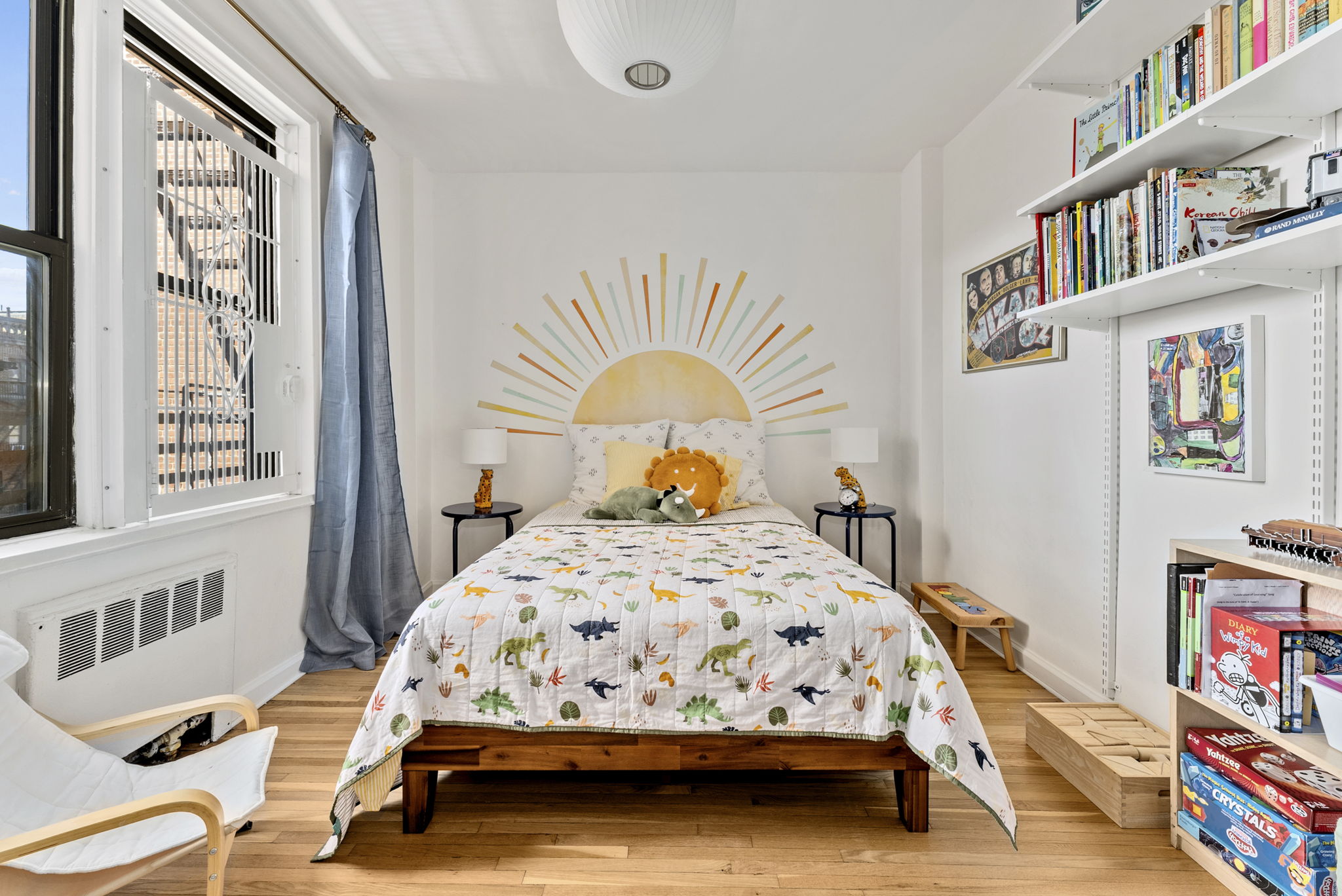 675 Academy Street, Unit 5E Manhattan, NY 10034 - Photo 8 of 10 a bedroom with a bed and a window