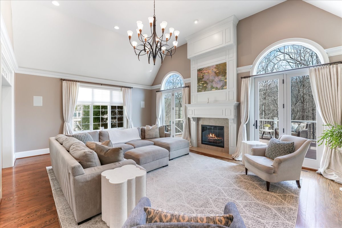 248 Valley Ridge Road Haverford, PA 19041 - Photo 16 of 44 a living room with furniture chandelier and a fireplace