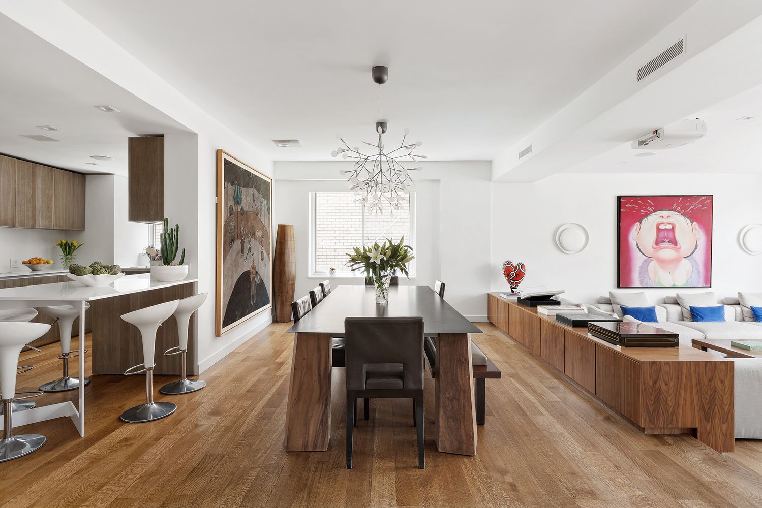 a view of a dining room with furniture kitchen and wooden floor