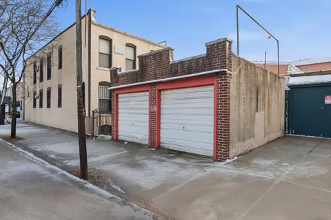 a front view of a house with a garage