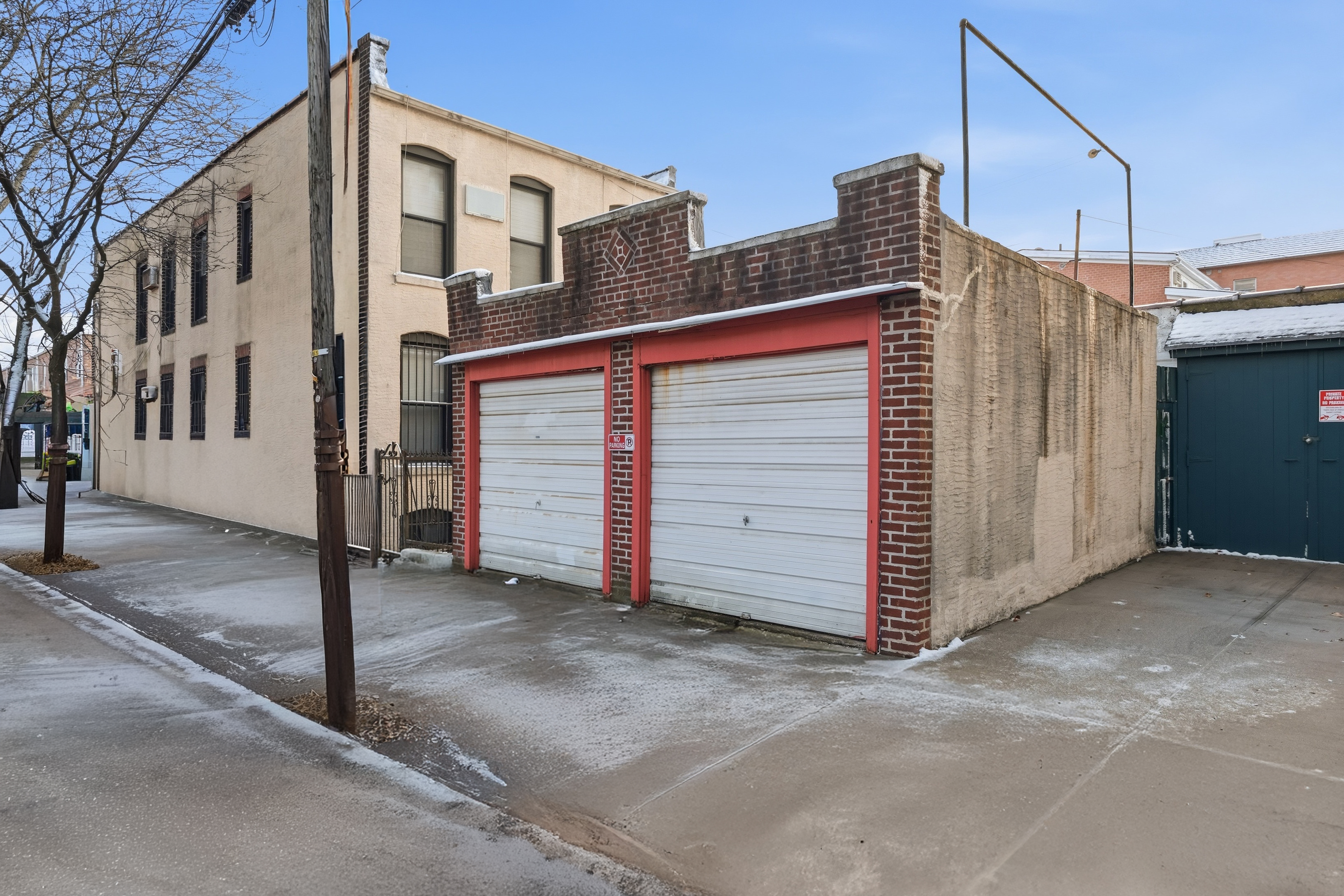 92 Battery Avenue Brooklyn, NY 11209 - Photo 2 of 2 a front view of a house with a garage