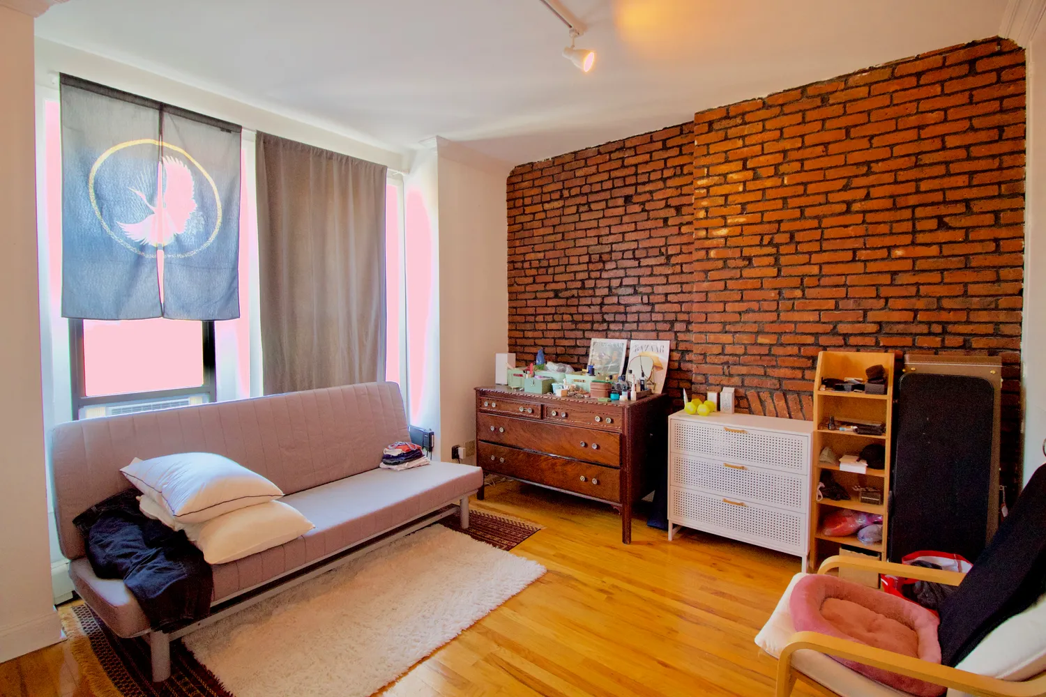 a bedroom with furniture and window