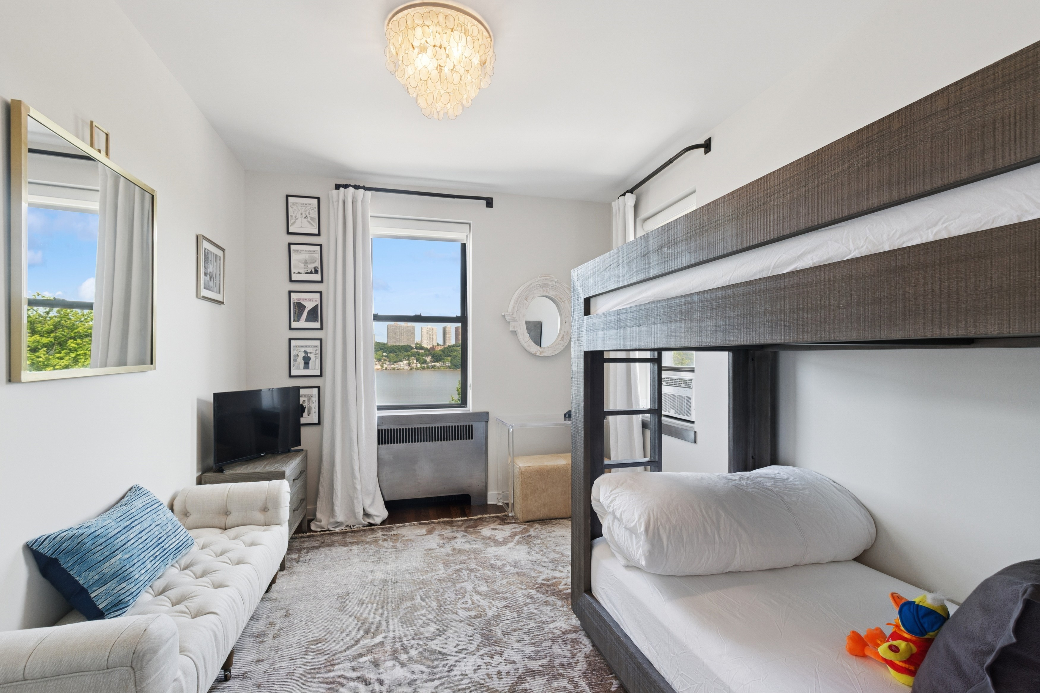 159-34 Riverside Drive West, Unit 5A Manhattan, NY 10032 - Photo 14 of 29 a living room with furniture and a window