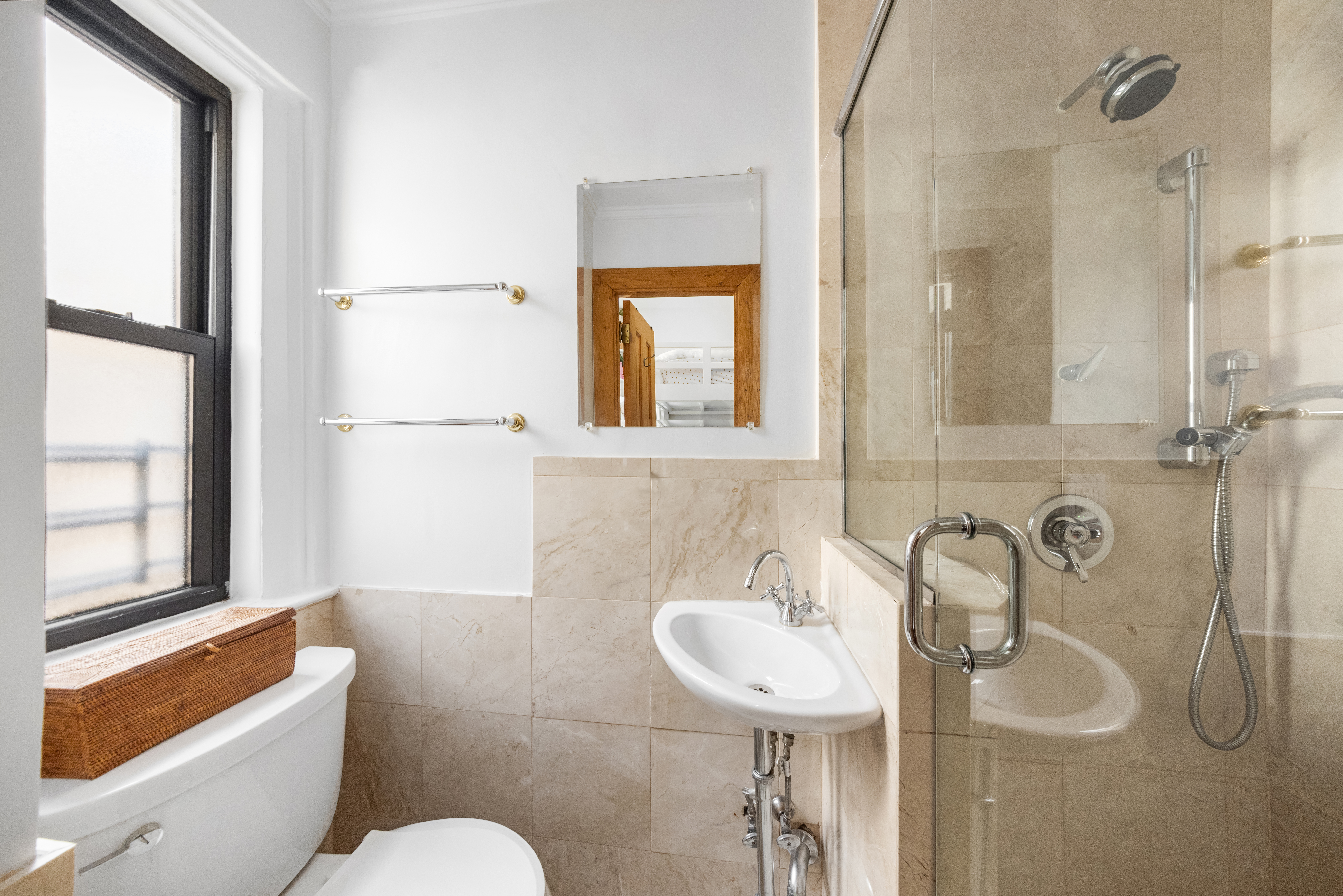 119 West 71st Street, Unit 9B Manhattan, NY 10023 - Photo 12 of 18 a bathroom with a sink mirror bathtub and toilet