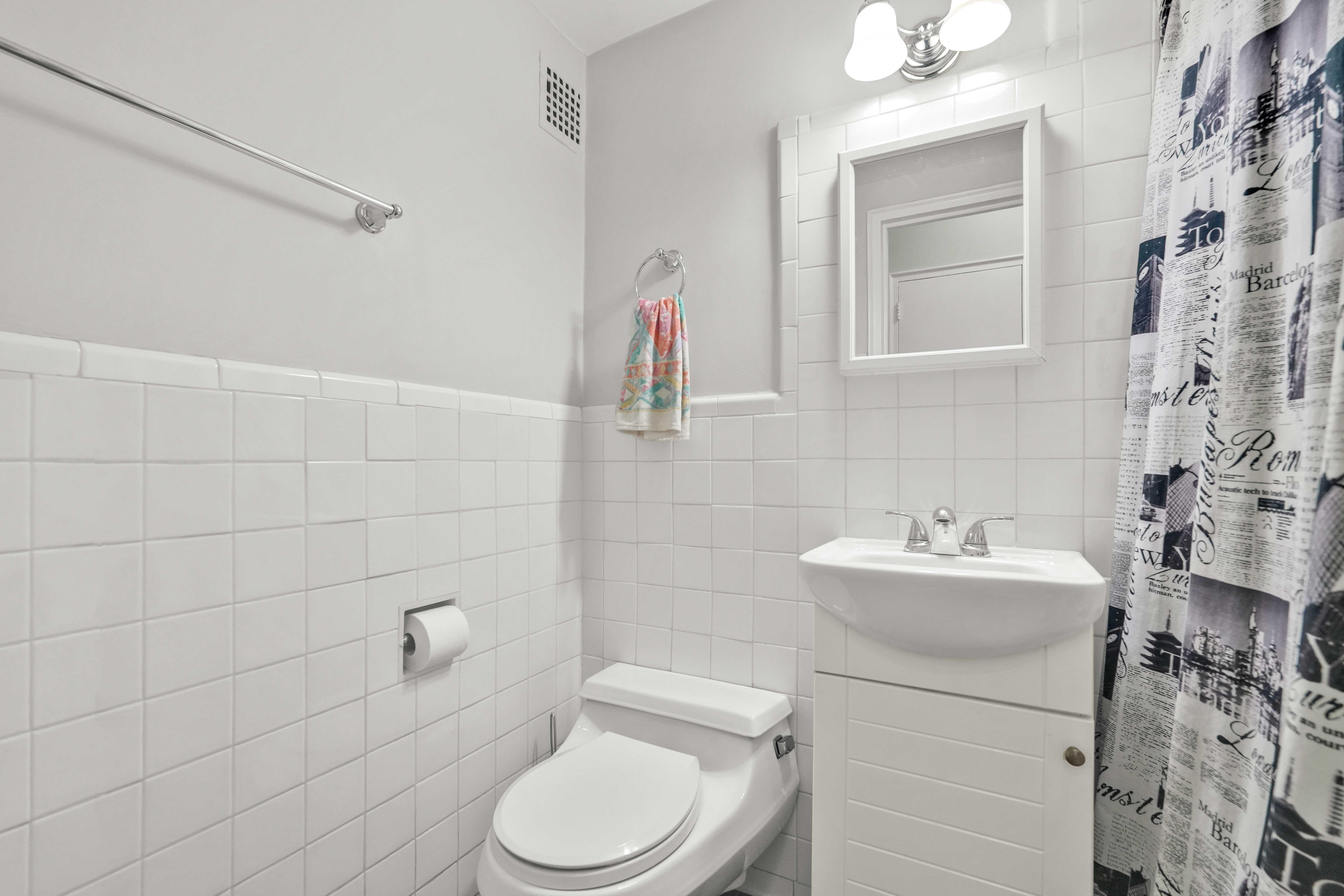 57 Montague Street, Unit 1D Brooklyn, NY 11201 - Photo 9 of 27 a bathroom with a sink a toilet and shower