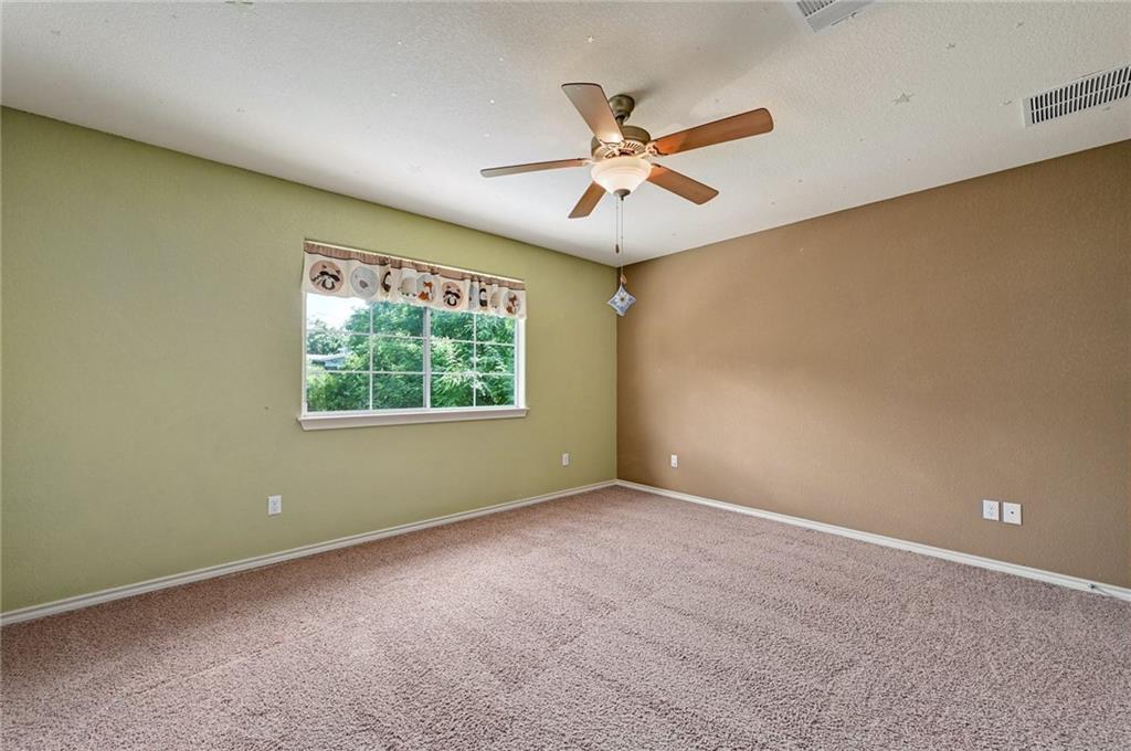 1102 Clermont Avenue Austin, TX 78702 - Photo 26 of 30 an empty room with a window and a fan