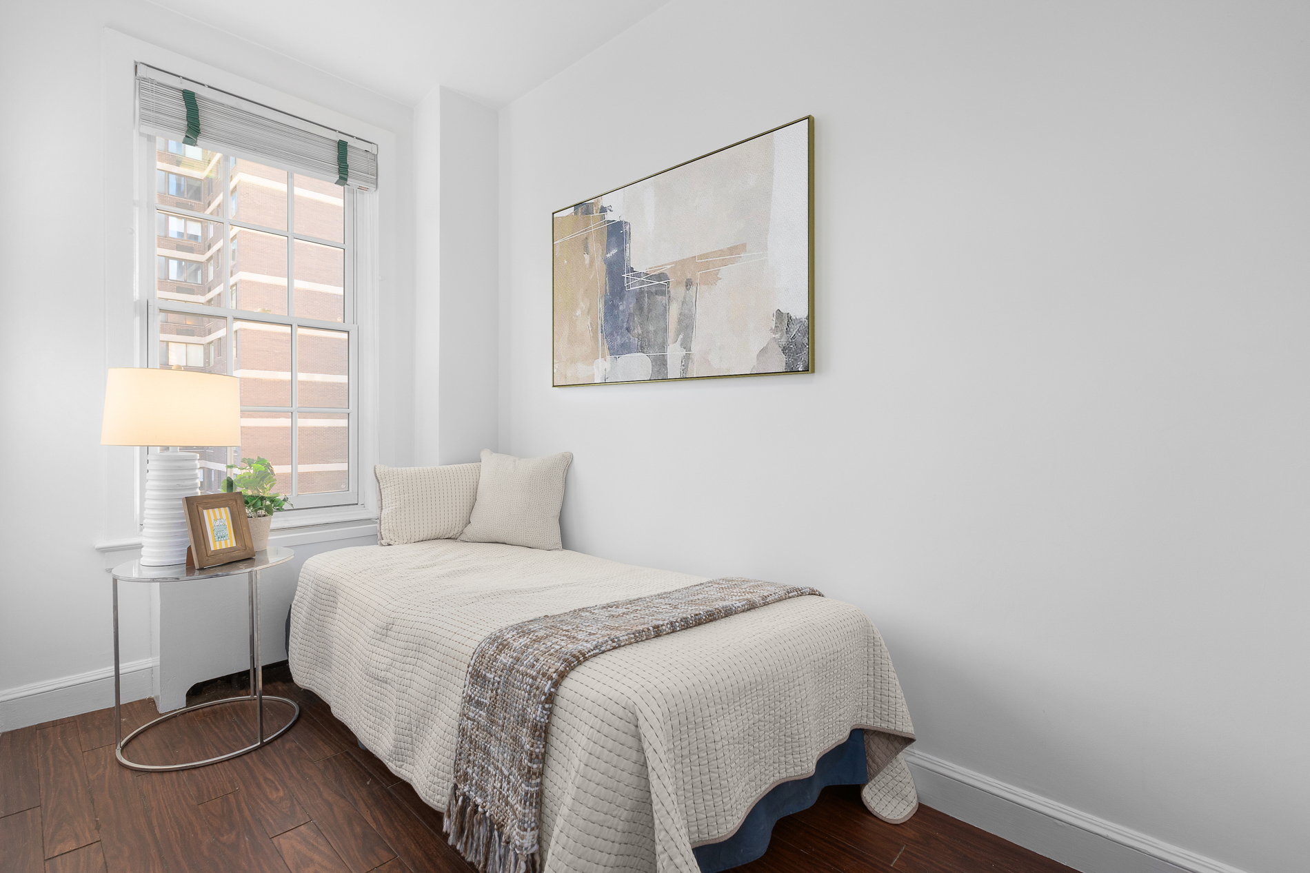 1088 Park Avenue, Unit 15C Manhattan, NY 10128 - Photo 17 of 26 a bedroom with a bed and a window