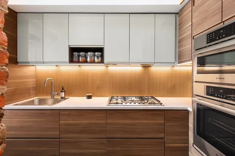 a kitchen with a sink and cabinets