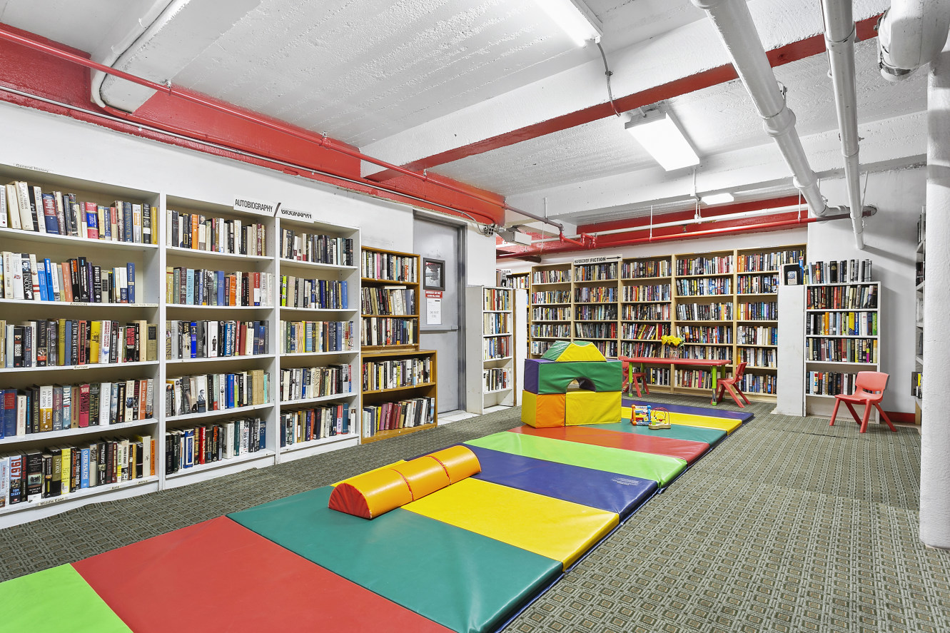 11 Riverside Drive, Unit 17E Manhattan, NY 10023 - Photo 15 of 16 a reading room with furniture and book shelf