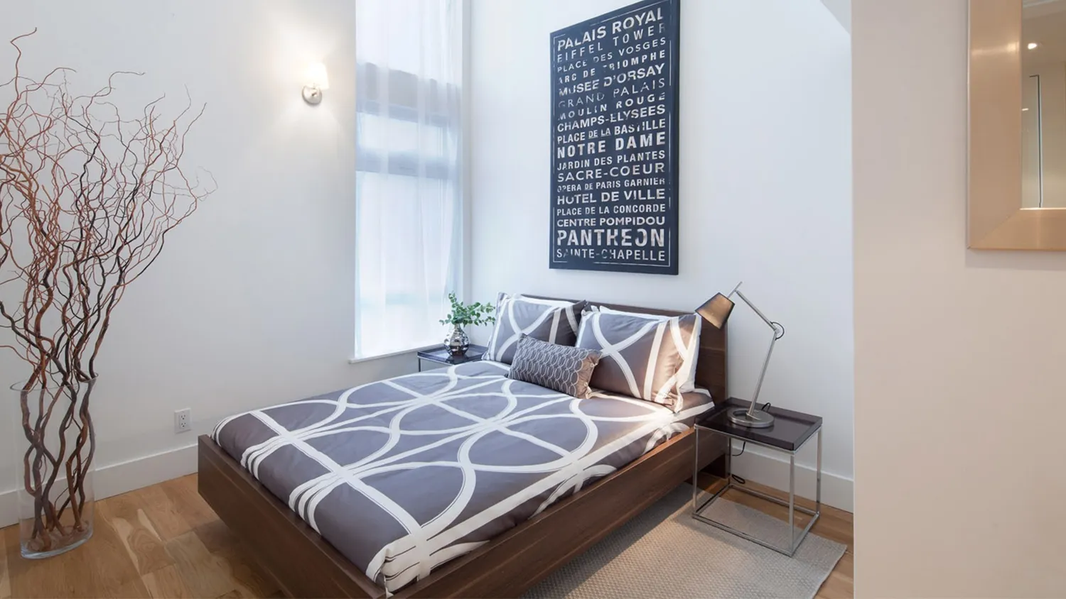 a bedroom with a bed and a window