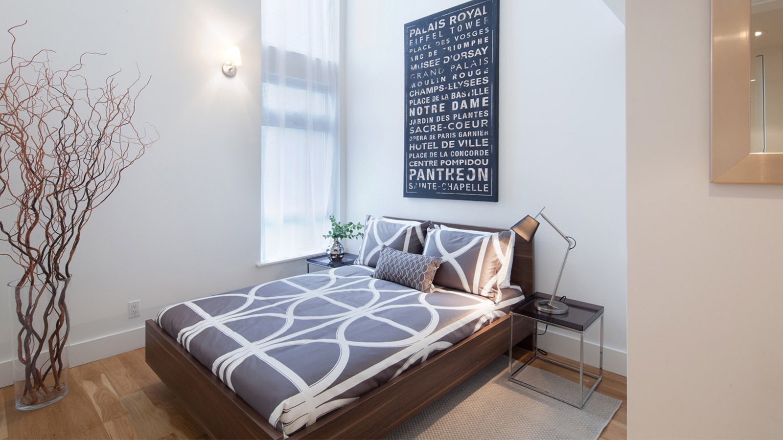 105 Grand Avenue, Unit 3B Brooklyn, NY 11205 - Photo 4 of 10 a bedroom with a bed and a window