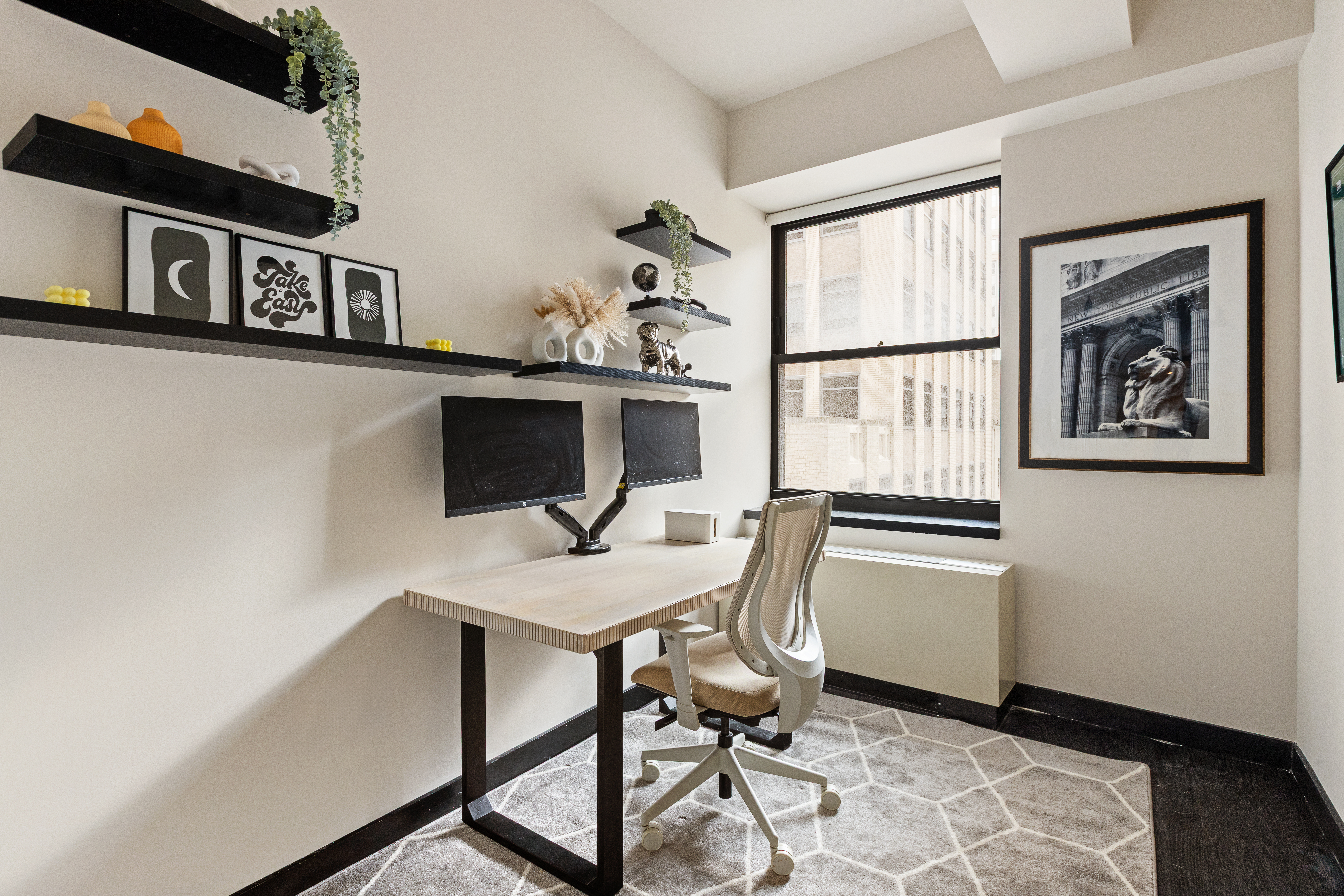 20 Pine Street, Unit 1205 Manhattan, NY 10005 - Photo 4 of 17 a workspace with furniture and a window