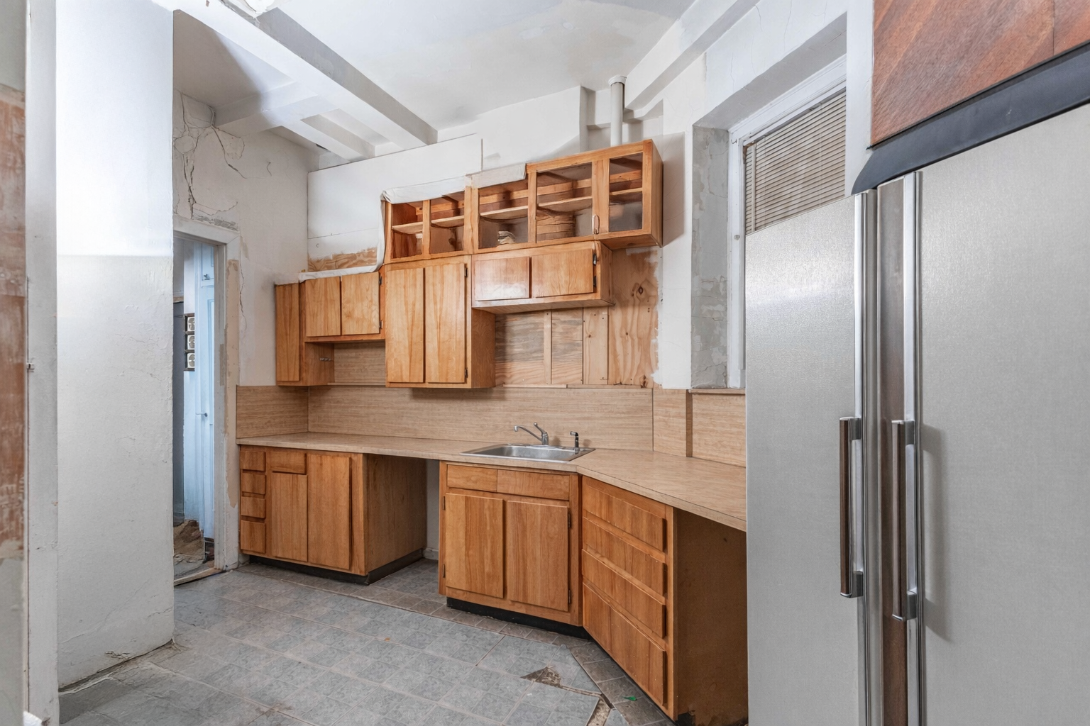 302 West 86th Street, Unit 1C Manhattan, NY 10024 - Photo 5 of 16 a kitchen with stainless steel appliances granite countertop a sink and cabinets