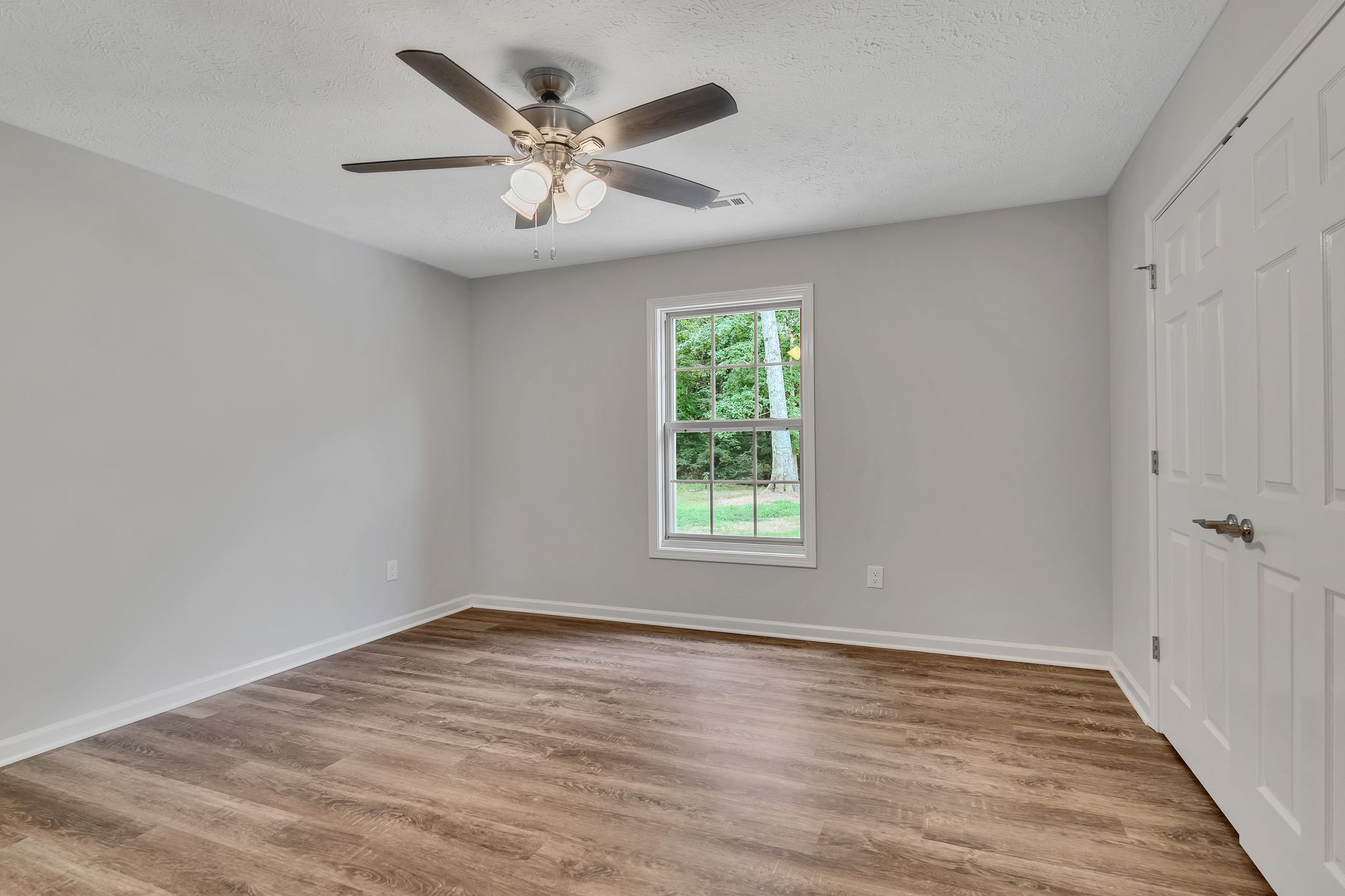 517 Paynes Church Road Estill Springs, TN 37330 - Photo 26 of 32 wooden floor in an empty room with a window