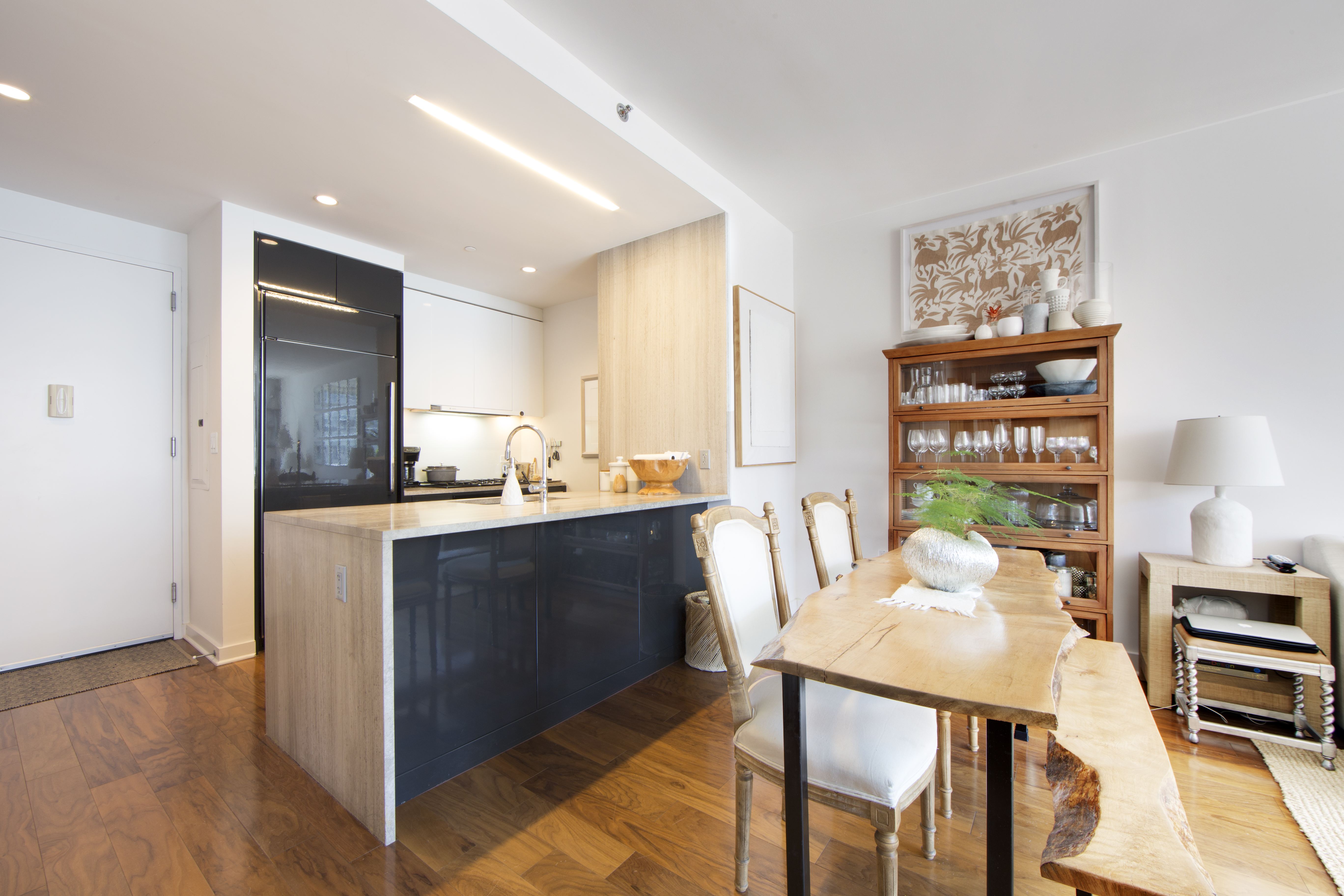 2 Northside Piers, Unit 4B Brooklyn, NY 11249 - Photo 6 of 18 a kitchen with a table and chairs in it