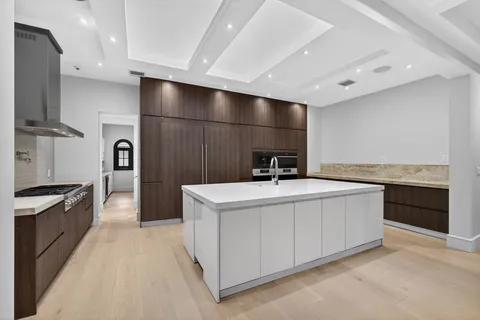 a kitchen with a sink stove and refrigerator