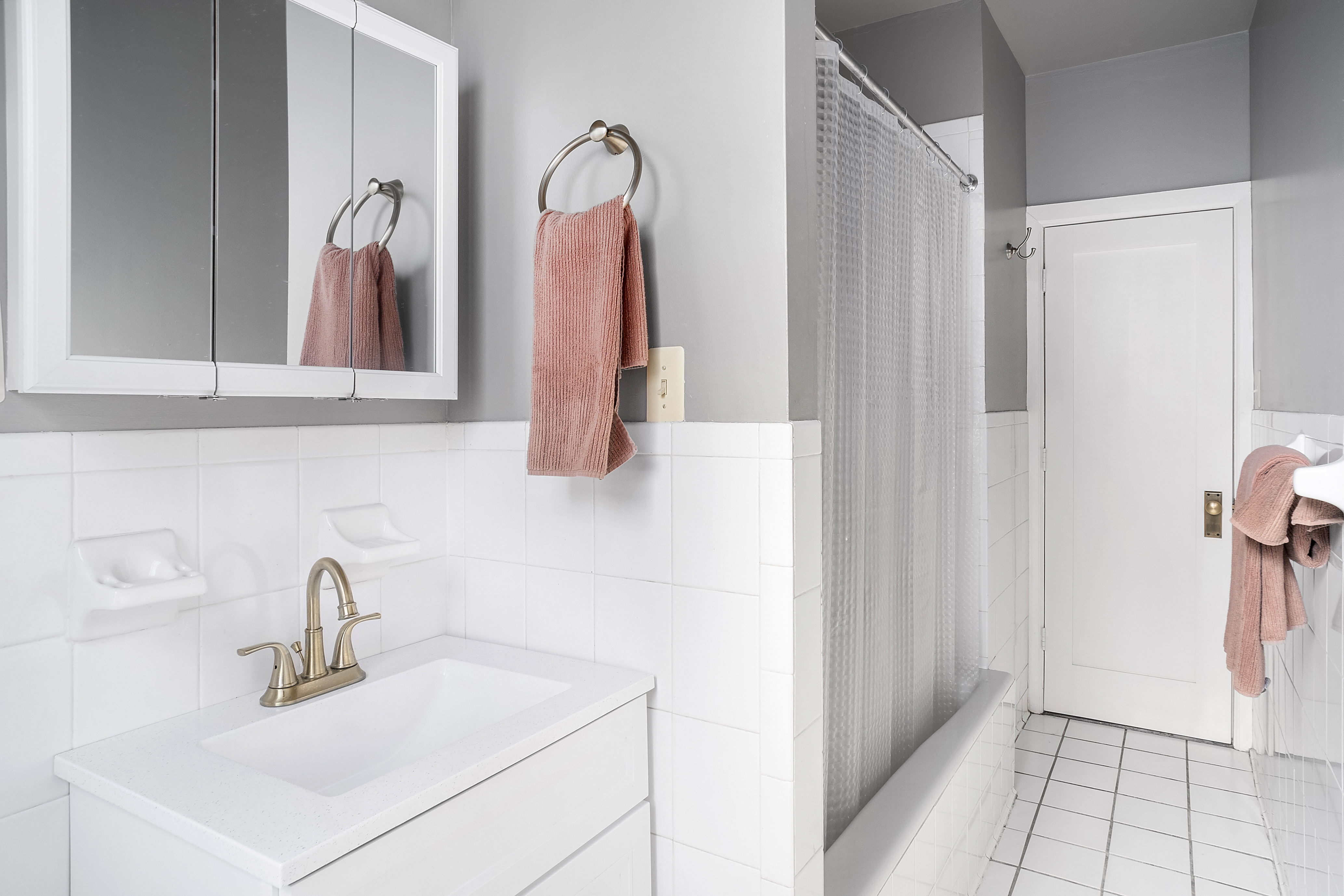 41 Convent Avenue, Unit 4L Manhattan, NY 10027 - Photo 3 of 13 a bathroom with a sink and a mirror