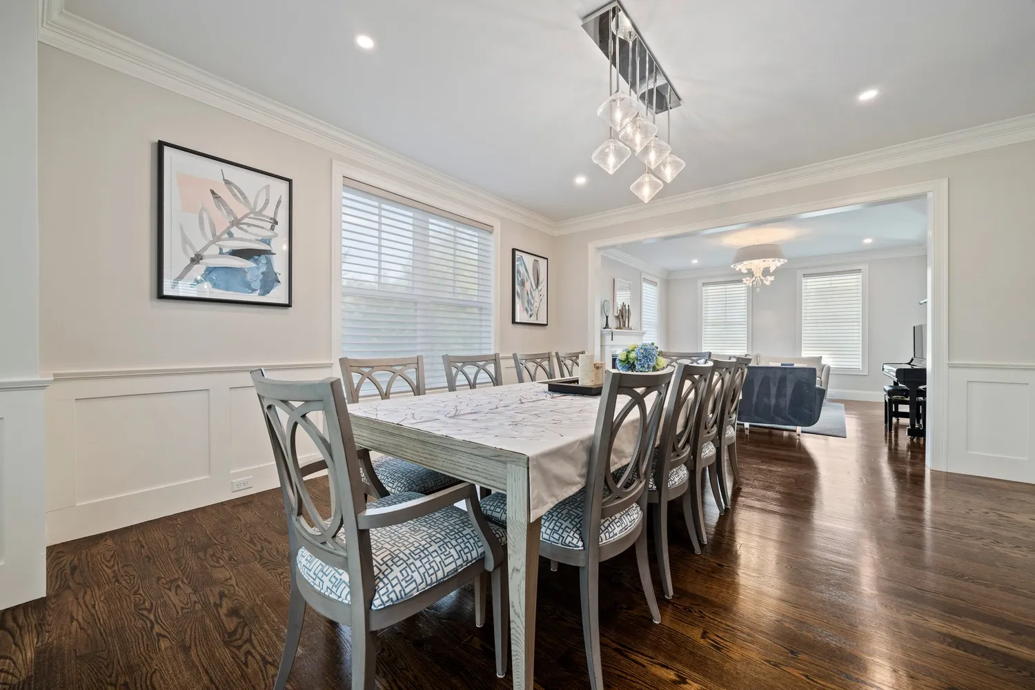a large white kitchen with a table and chairs