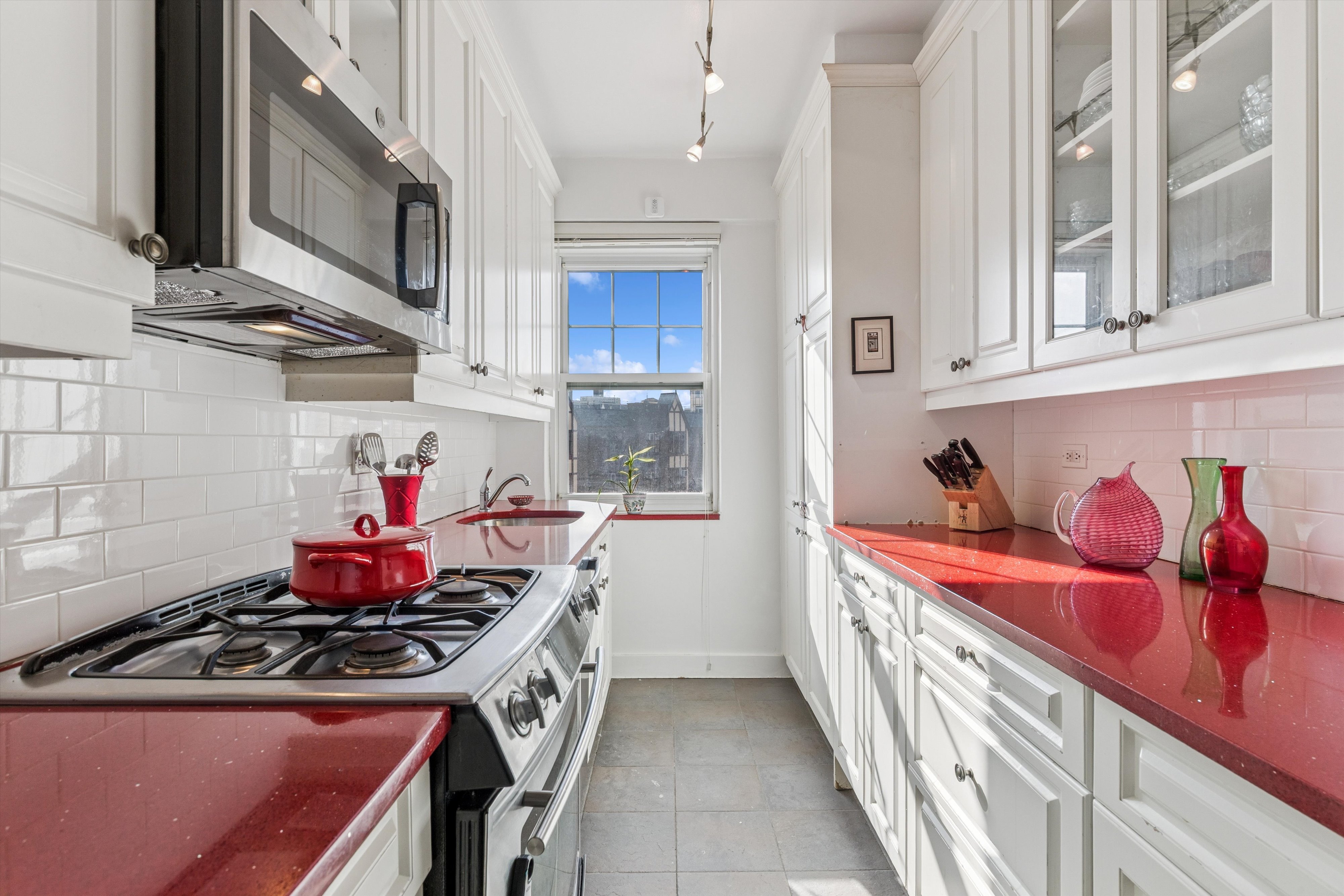 200 Cabrini Boulevard, Unit 86 Manhattan, NY 10033 - Photo 9 of 26 a kitchen with stainless steel appliances granite countertop a stove and a sink