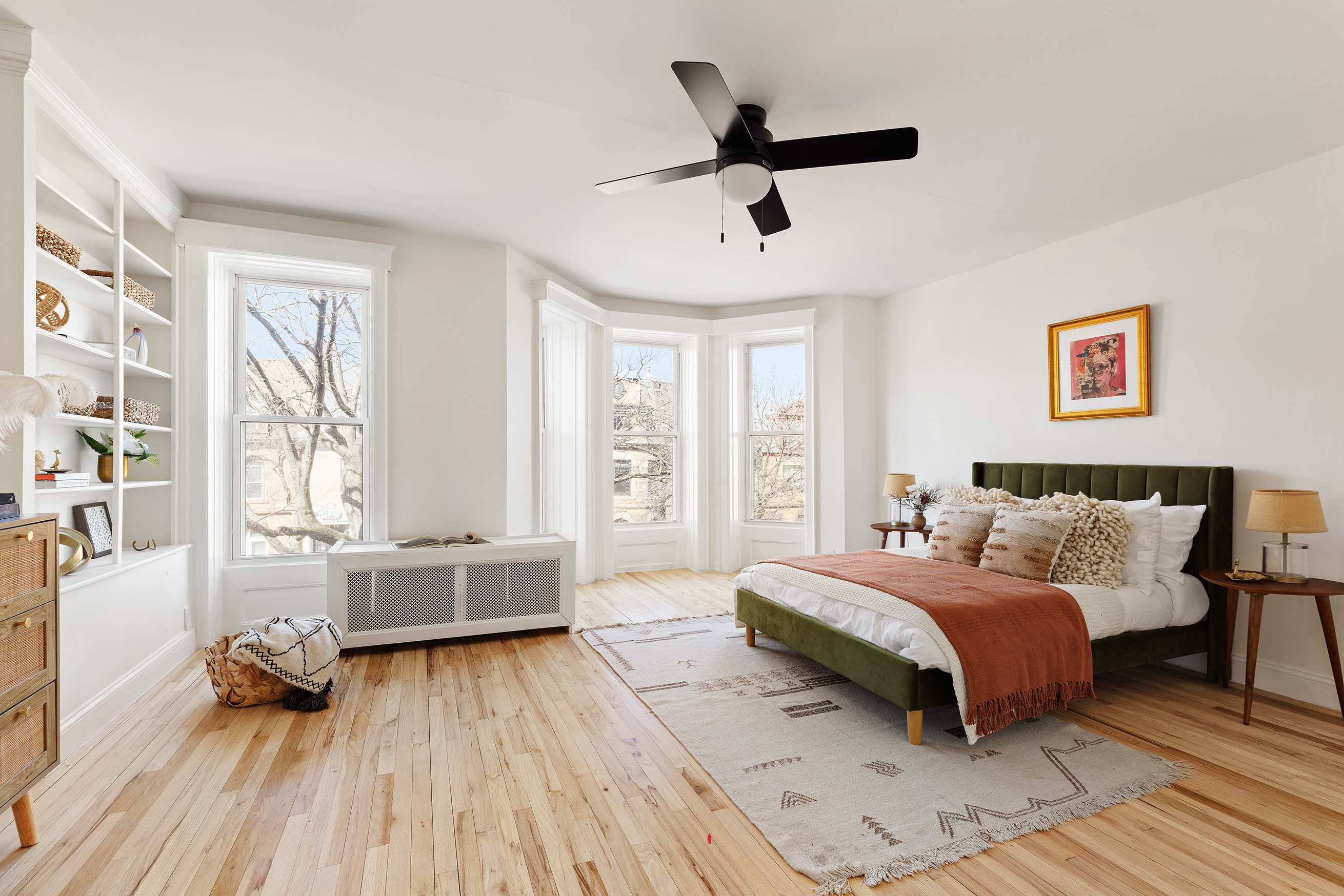 259 New York Avenue Brooklyn, NY 11216 - Photo 17 of 25 a bedroom with a bed and wooden floor