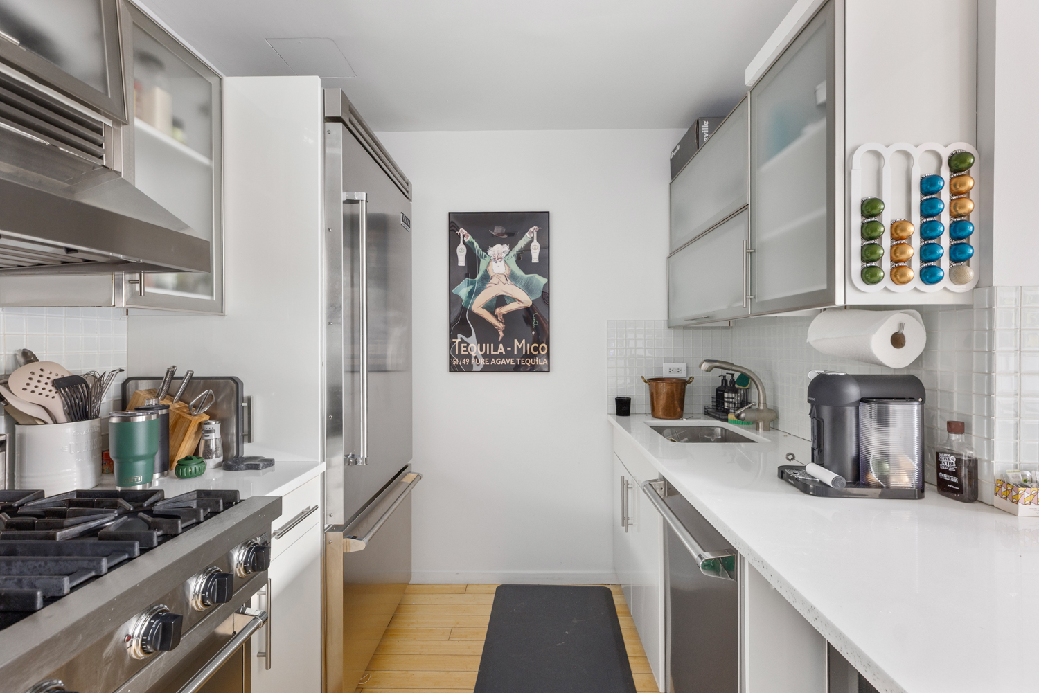 105 Norfolk Street, Unit 2A Manhattan, NY 10002 - Photo 6 of 16 a kitchen with stainless steel appliances granite countertop a stove and a sink