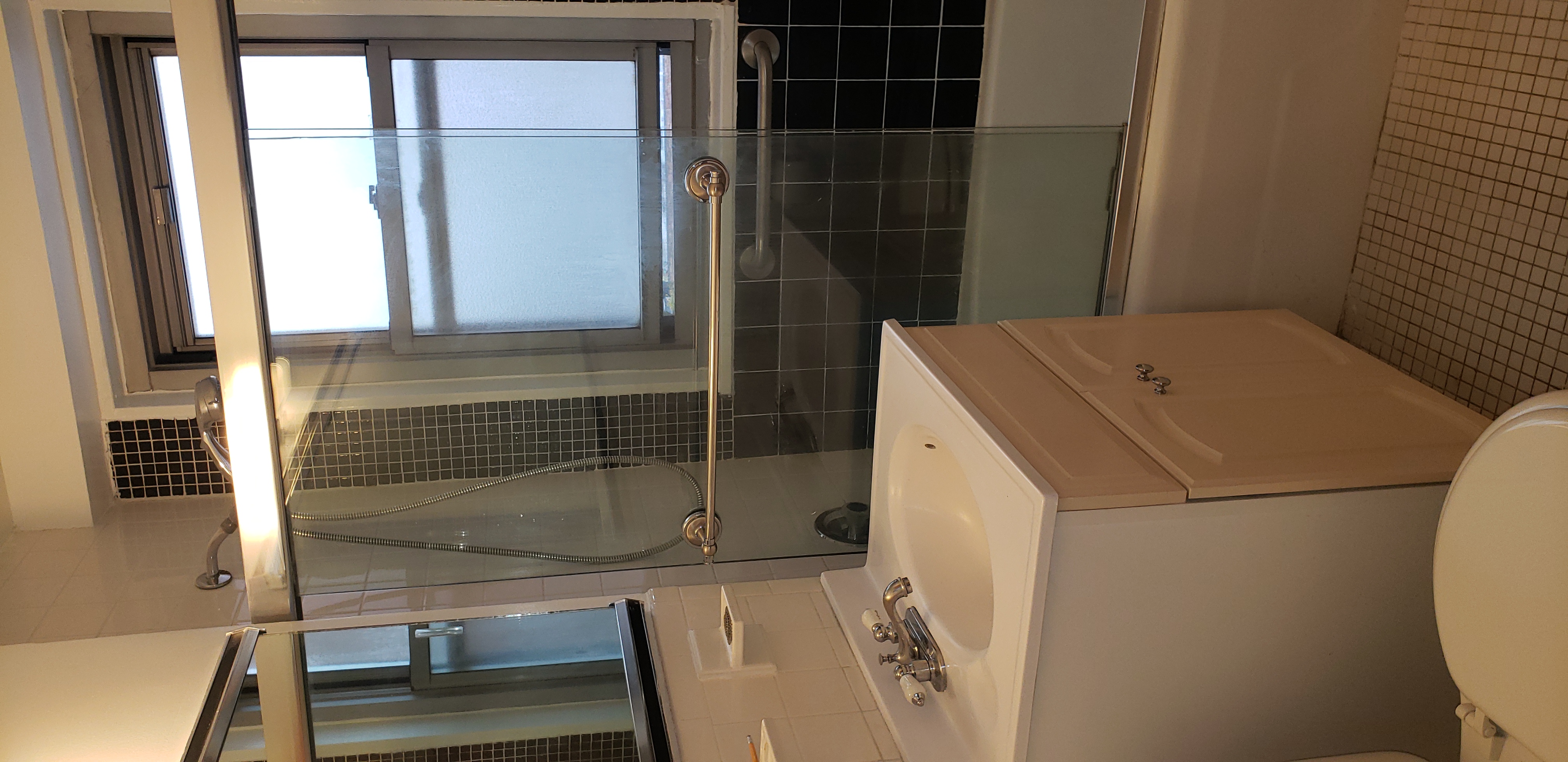 70-25 Yellowstone Boulevard, Unit 11D Queens, NY 11375 - Photo 14 of 25 a bathroom with a sink toilet and shower