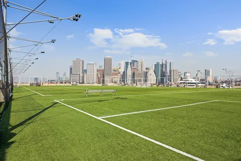 a view of a lake with tall building
