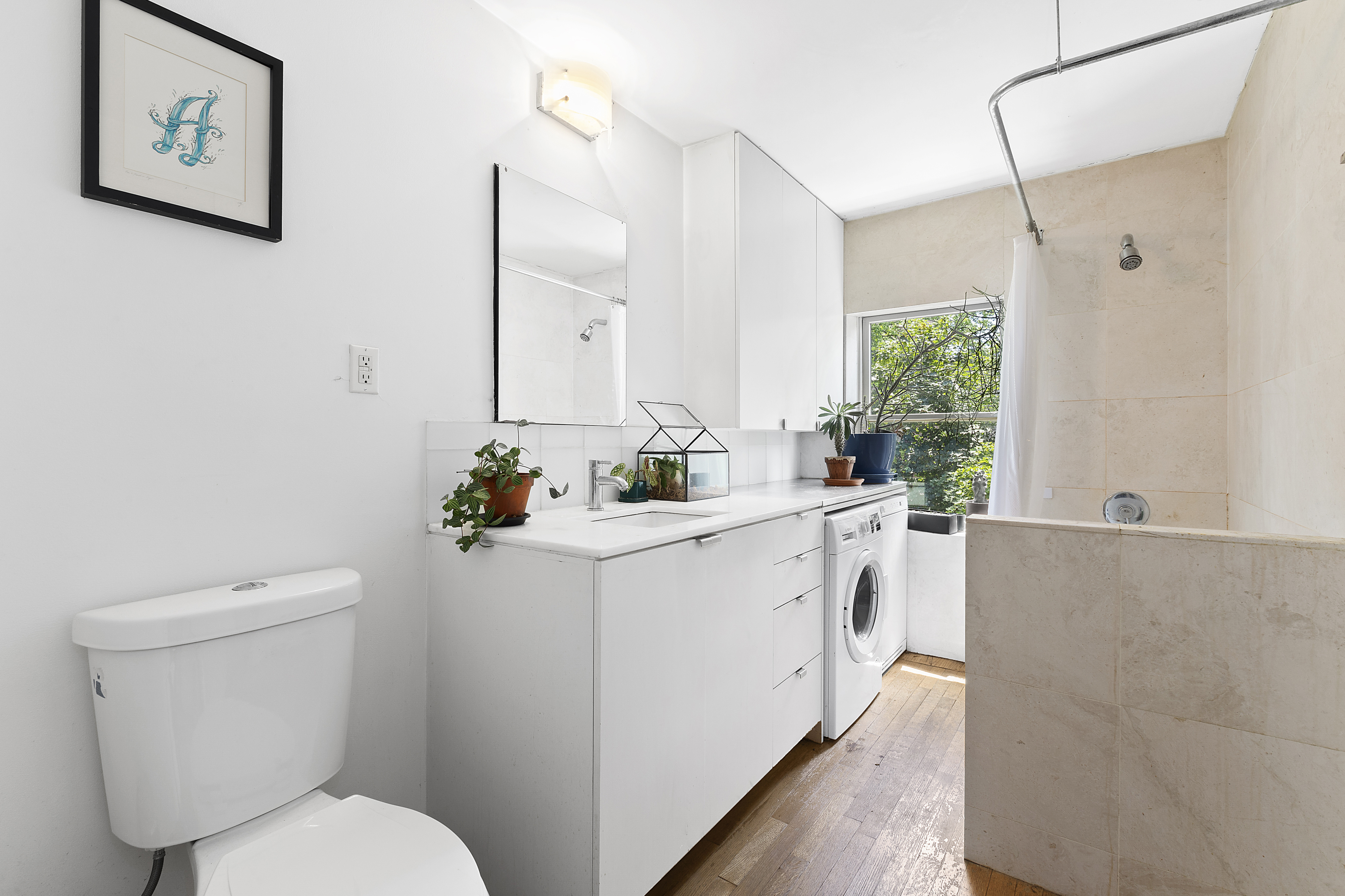 64 Clifton Place Brooklyn, NY 11238 - Photo 20 of 22 a white toilet sitting next to a bathroom sink