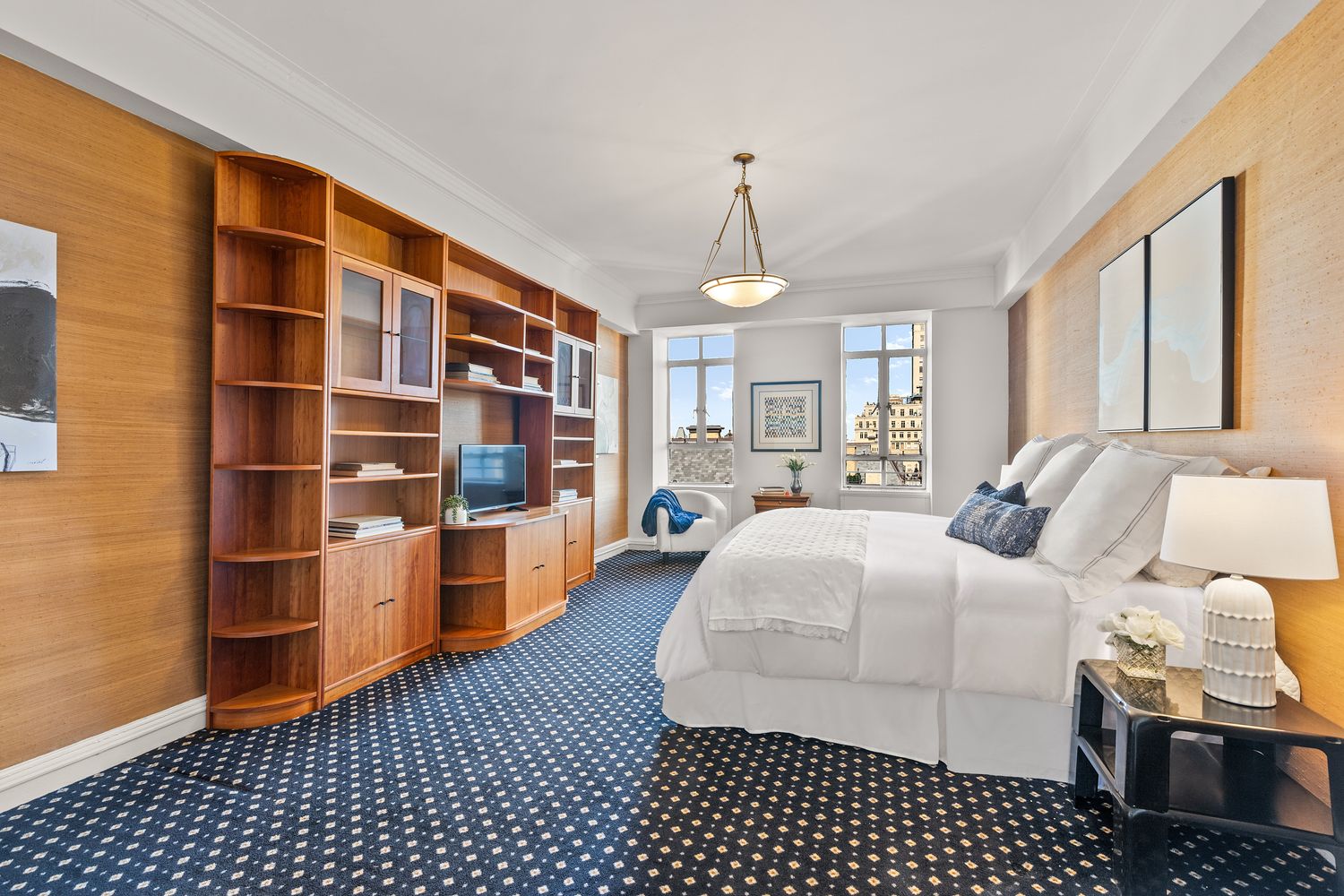 a bedroom with furniture and a book shelf
