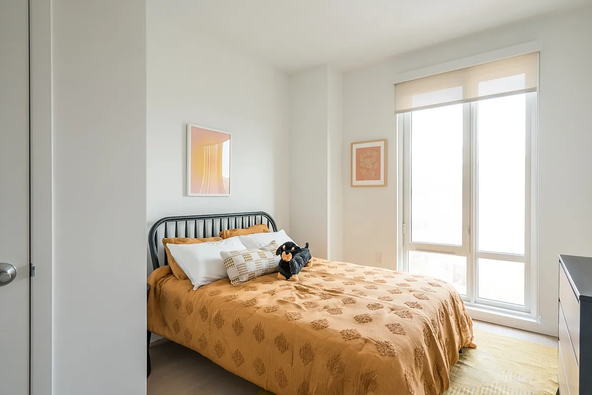 975 Nostrand Avenue, Unit 330 Brooklyn, NY 11225 - Photo 5 of 21 a bedroom with a bed and a window