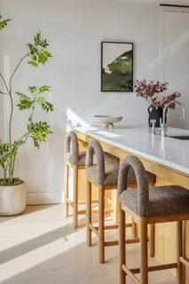 a living room with furniture and flowers