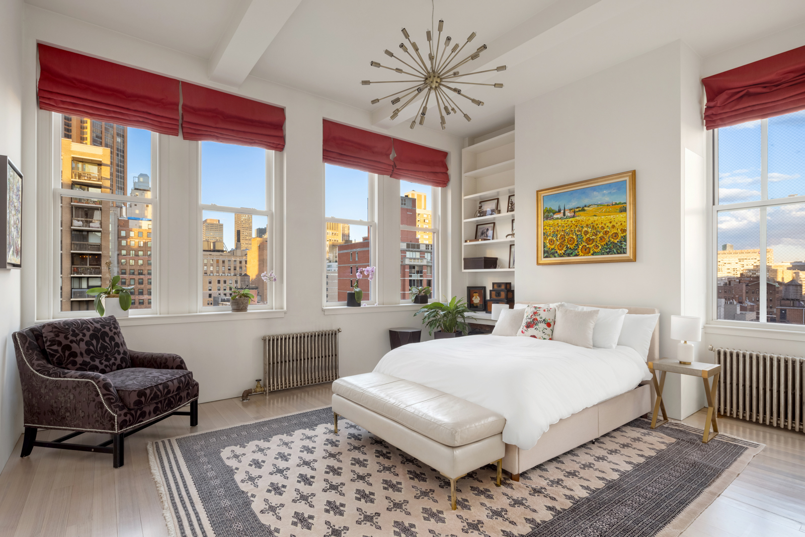 105 East 29th Street, Unit 12PH Manhattan, NY 10016 - Photo 12 of 24 a spacious bedroom with a bed a couch and a window