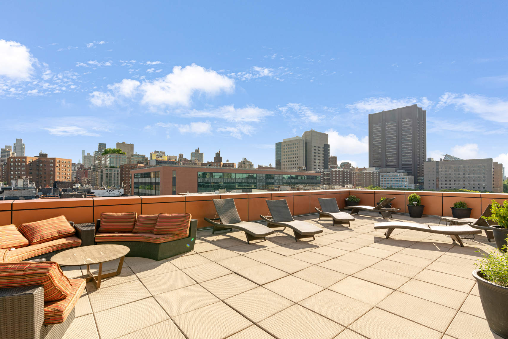 1595 Lexington Avenue, Unit 4H Manhattan, NY 10029 - Photo 8 of 9 a view of roof deck with seating area and barbeque oven
